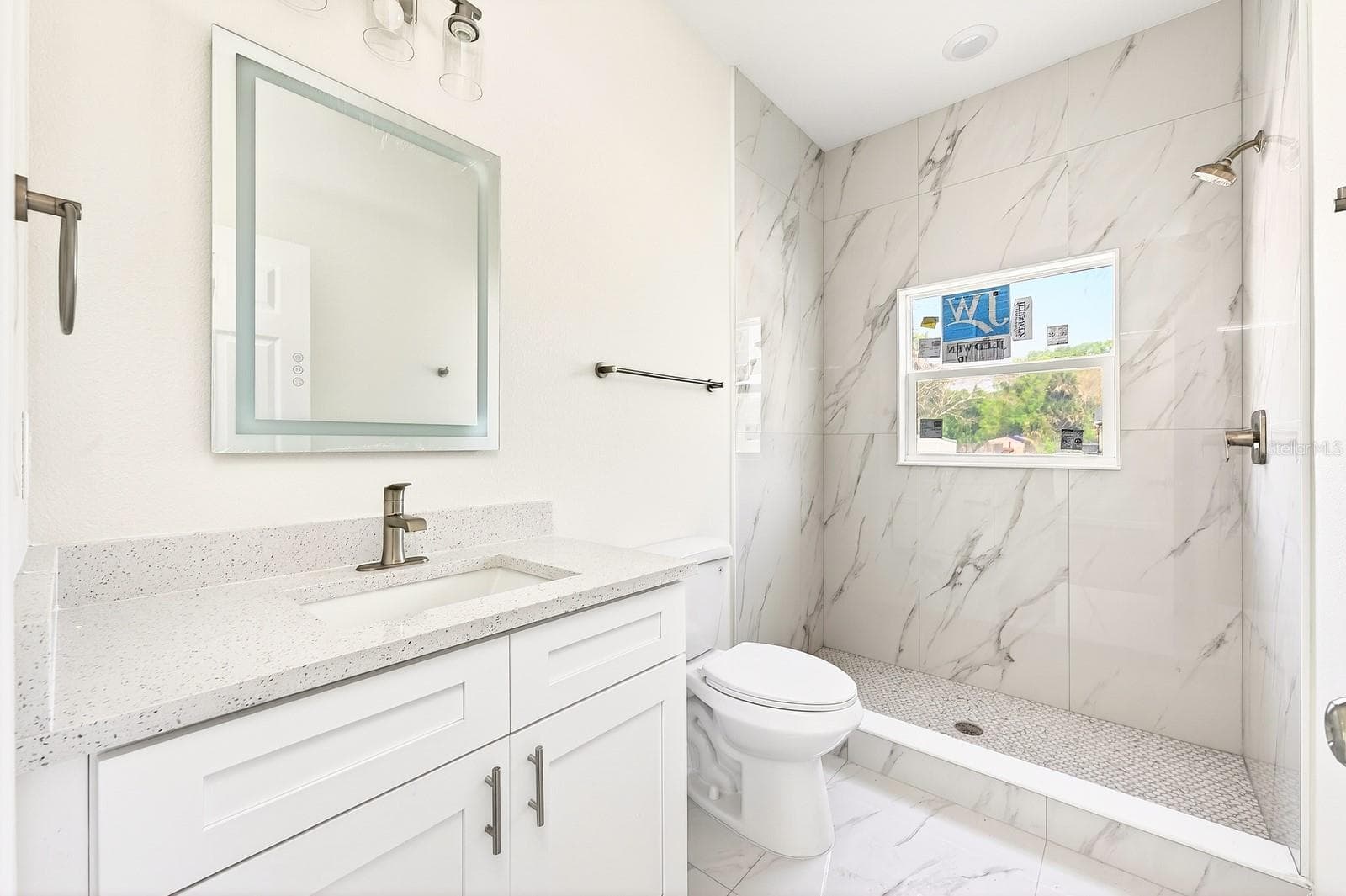 Primary en-suite bath. - 702 LUCKY ST, TITUSVILLE