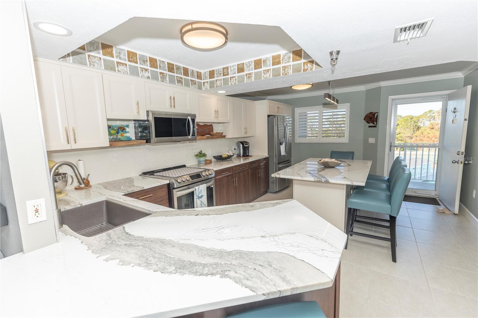 Large Renovated Kitchen With Breakfast Bar Seating! - 1401 S MCCALL RD #B-306, ENGLEWOOD