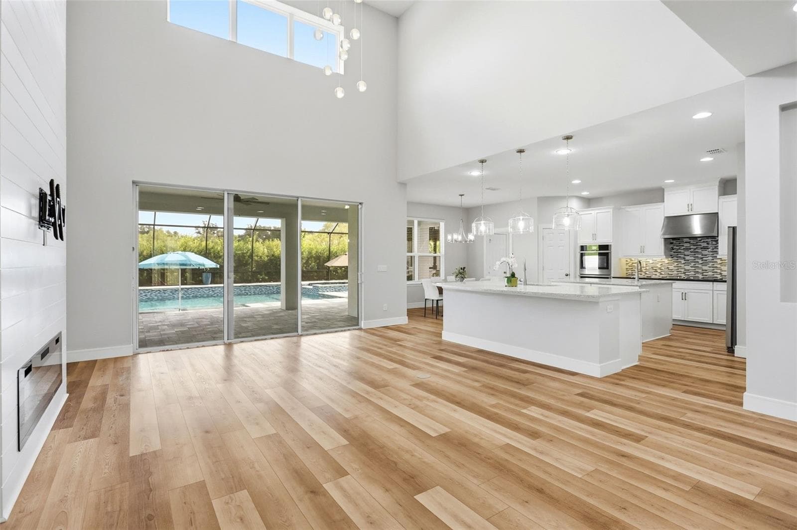 Newer luxury plank vinyl flooring throughout the downstairs - 1552 MYRTLE OAKS TRL, OVIEDO