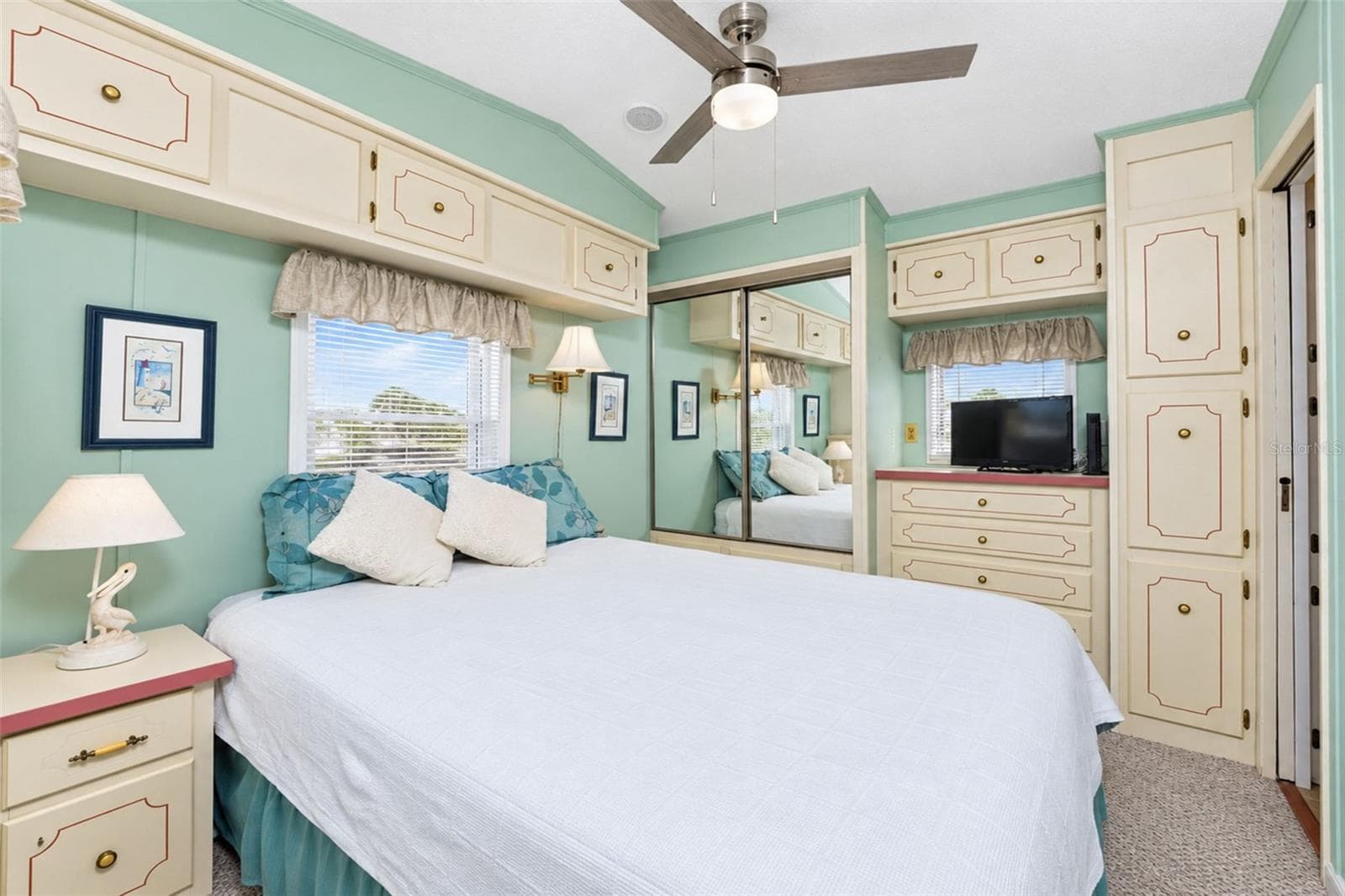 bedroom with lots of natural light and tons of storage - 39 CROWN POINT DR, NOKOMIS