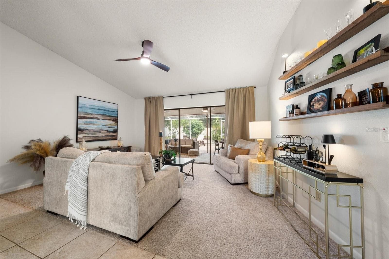 Formal living spaces have a panoramic view of the paved and covered lanai. - 1105 DEER RUN PL, VALRICO