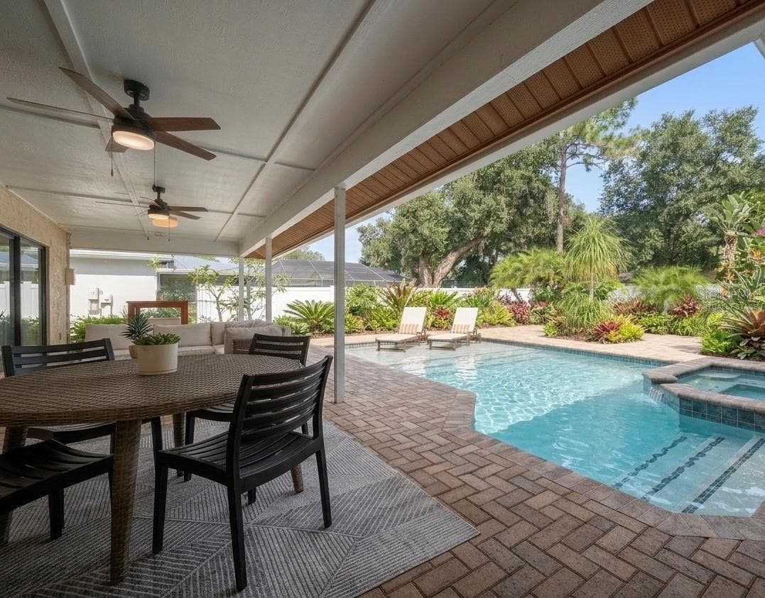Looking out from the patio at a virtually staged pool concept for the backyard. - 1105 DEER RUN PL, VALRICO
