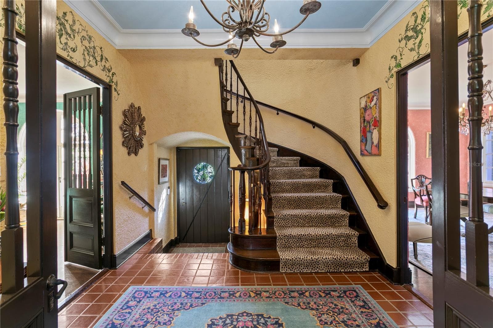 Foyer looking towards the front door flanked by the Living Room on the left and the Dining Room to the right. Nine foot ceilings in both levels. - 7211 3RD AVE S, ST PETERSBURG