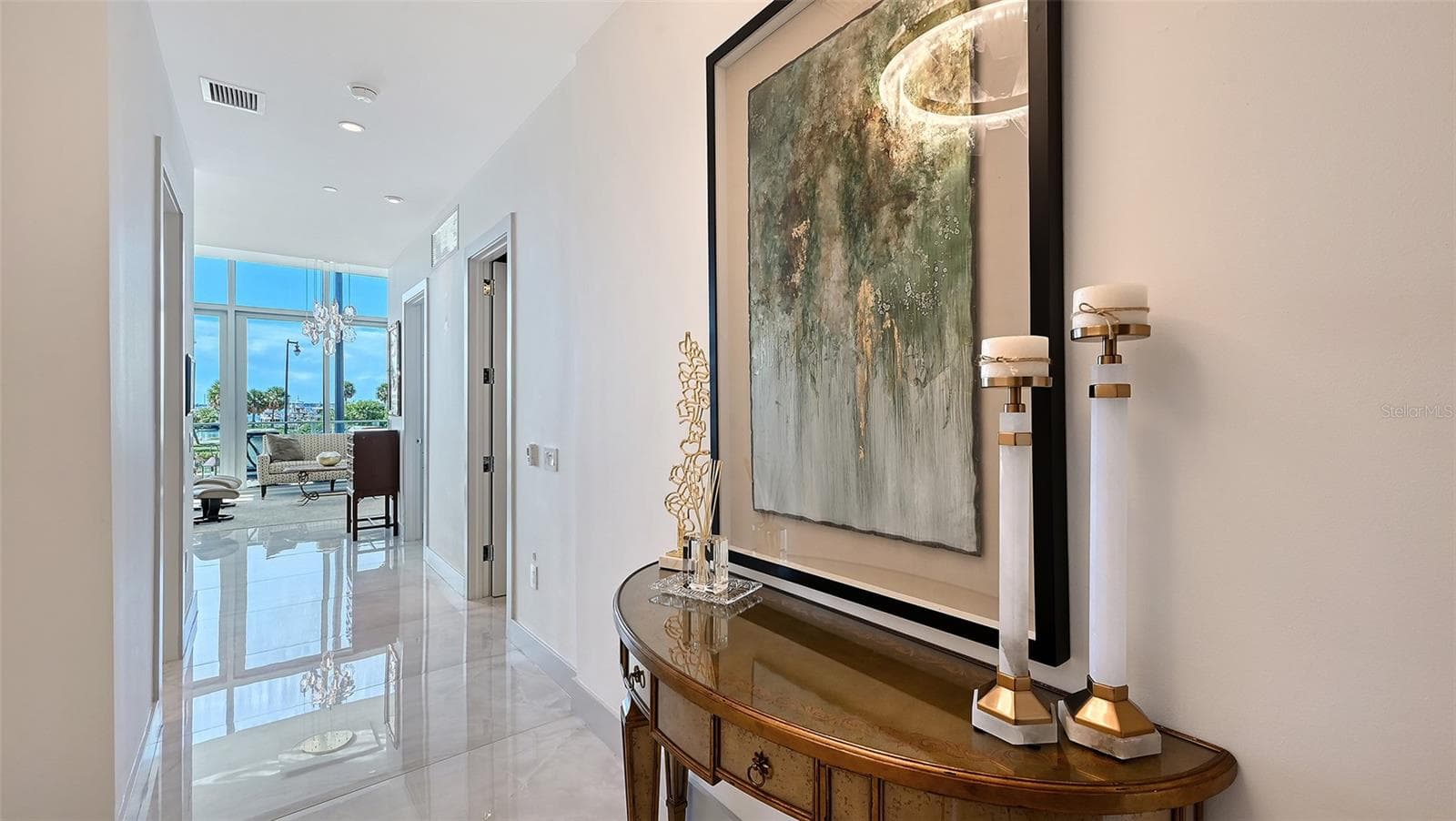 Step into a welcoming foyer with breathtaking views of Sarasota Bay unfolding directly ahead. - 1155 N GULFSTREAM AVE #207, SARASOTA