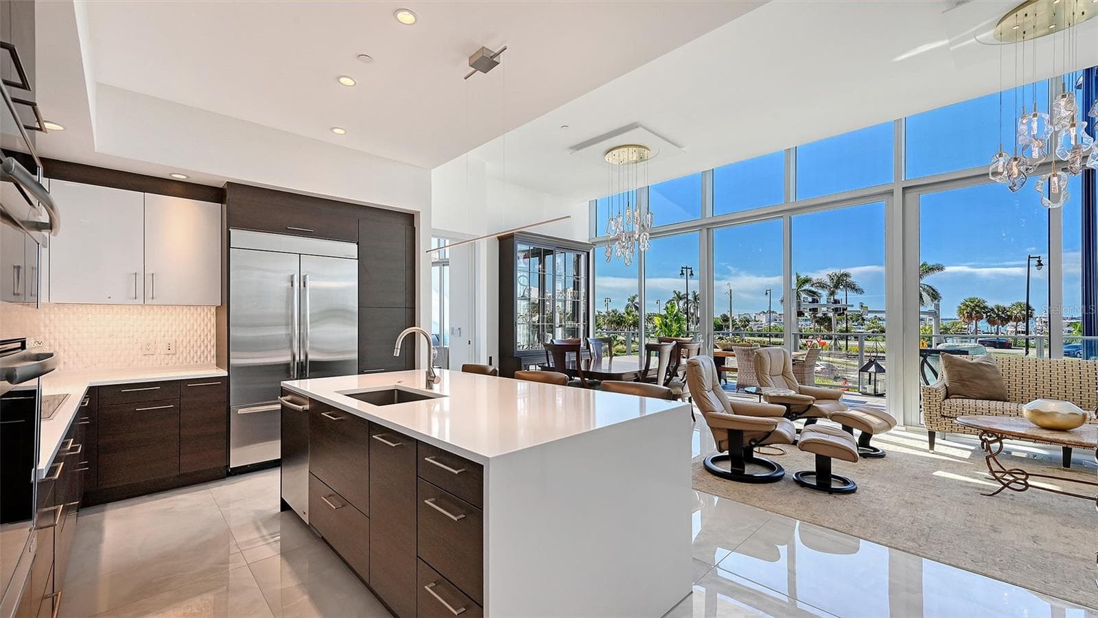 The heart of the kitchen, offering an inviting space for guests to gather while you entertain. - 1155 N GULFSTREAM AVE #207, SARASOTA