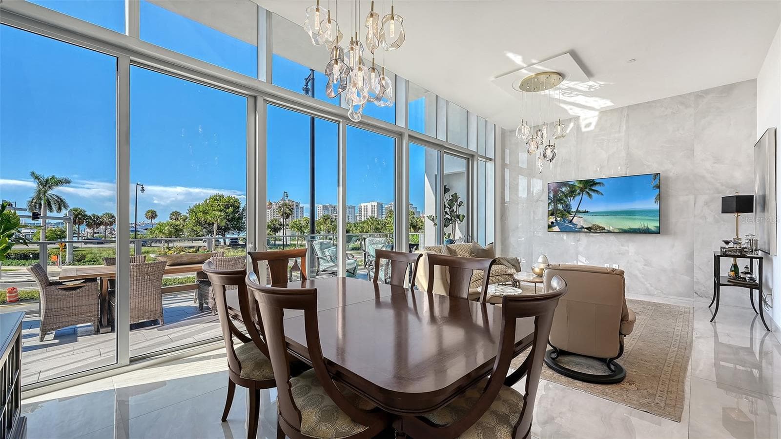 Ideal for entertaining, the spacious kitchen, dining, and living areas flow seamlessly together in an elegant, open-concept design. - 1155 N GULFSTREAM AVE #207, SARASOTA