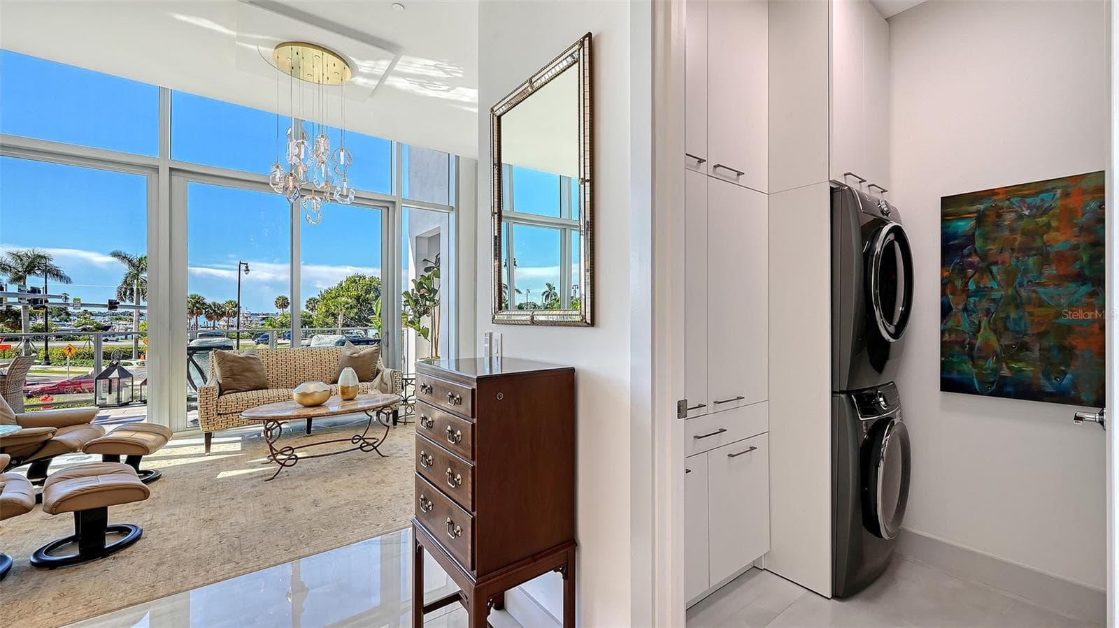 Custom-designed laundry room featuring a new, full-size LG WashTower and custom cabinetry for exceptional storage and organization. - 1155 N GULFSTREAM AVE #207, SARASOTA