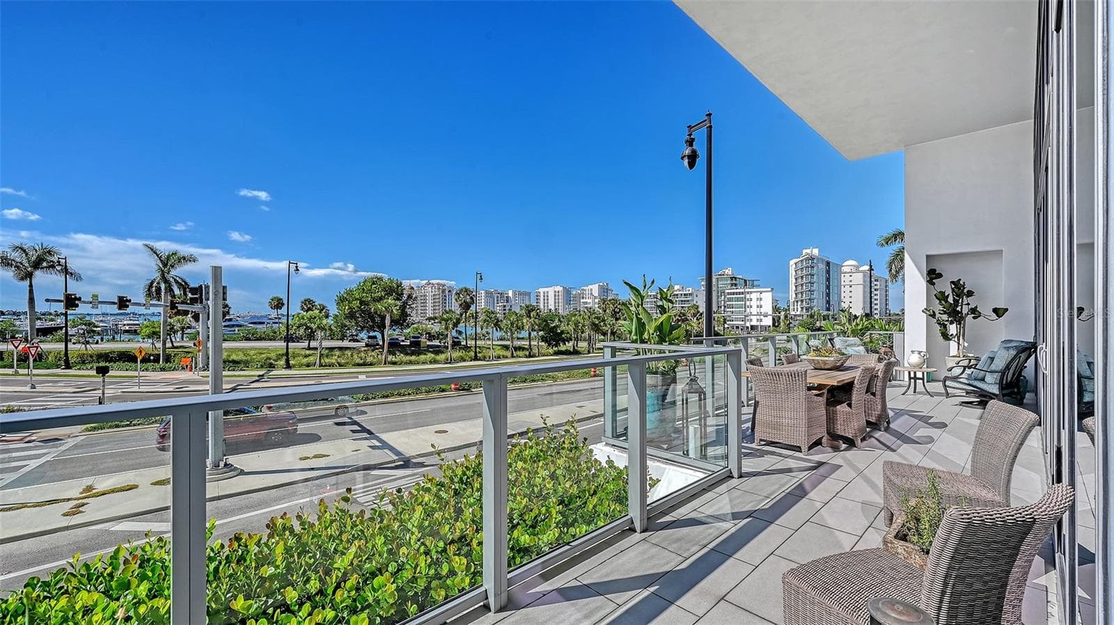 The inviting seating area offers the perfect setting to relax and enjoy Sarasota Bay. - 1155 N GULFSTREAM AVE #207, SARASOTA