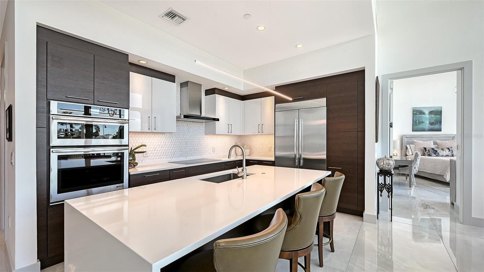A beautifully appointed kitchen featuring top-of-the-line appliances, perfect for the culinary enthusiast and sophisticated entertaining - 1155 N GULFSTREAM AVE #207, SARASOTA
