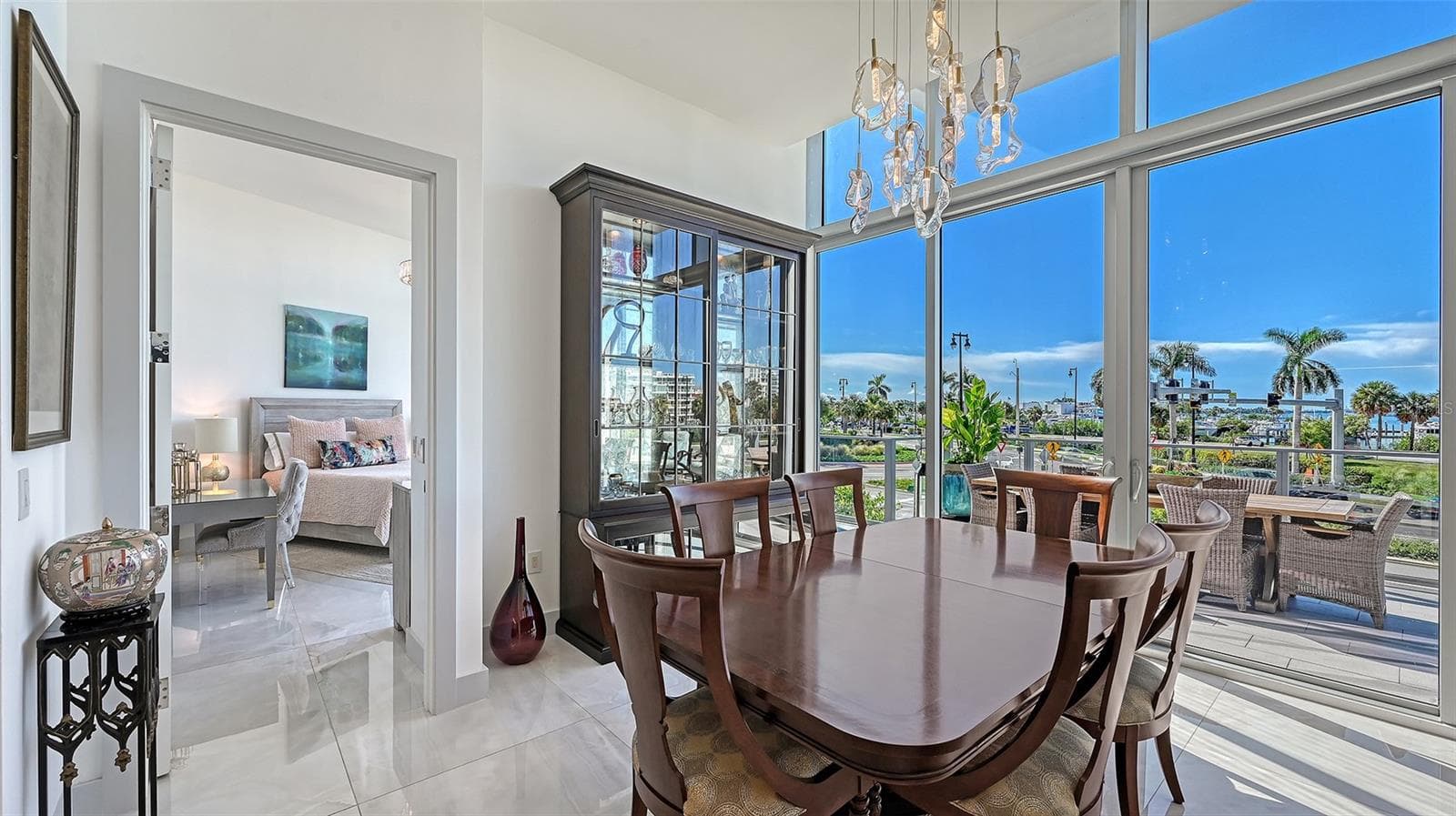 Bathed in natural light, this refined space offers the perfect setting for memorable dining and upscale entertaining. - 1155 N GULFSTREAM AVE #207, SARASOTA