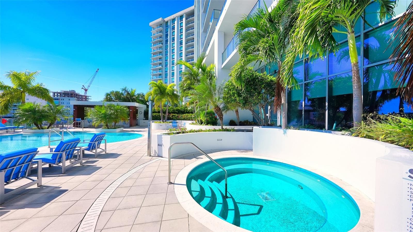 Unwind in the poolside spa, the perfect retreat for relaxation and rejuvenation. - 1155 N GULFSTREAM AVE #207, SARASOTA