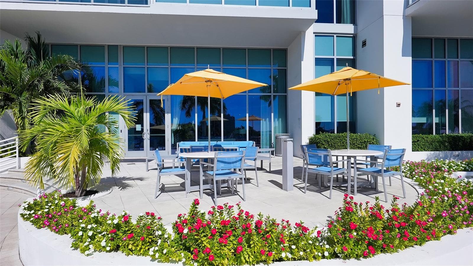 Enjoy leisurely poolside dining, friendly card games, and relaxed gatherings in a beautiful resort-style setting. - 1155 N GULFSTREAM AVE #207, SARASOTA