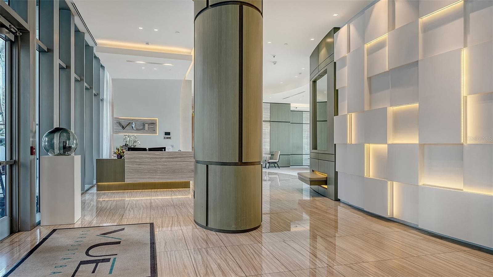 Welcome to The VUE, where a grand lobby with soaring ceilings creates an impressive first impression of luxury and sophistication. - 1155 N GULFSTREAM AVE #207, SARASOTA