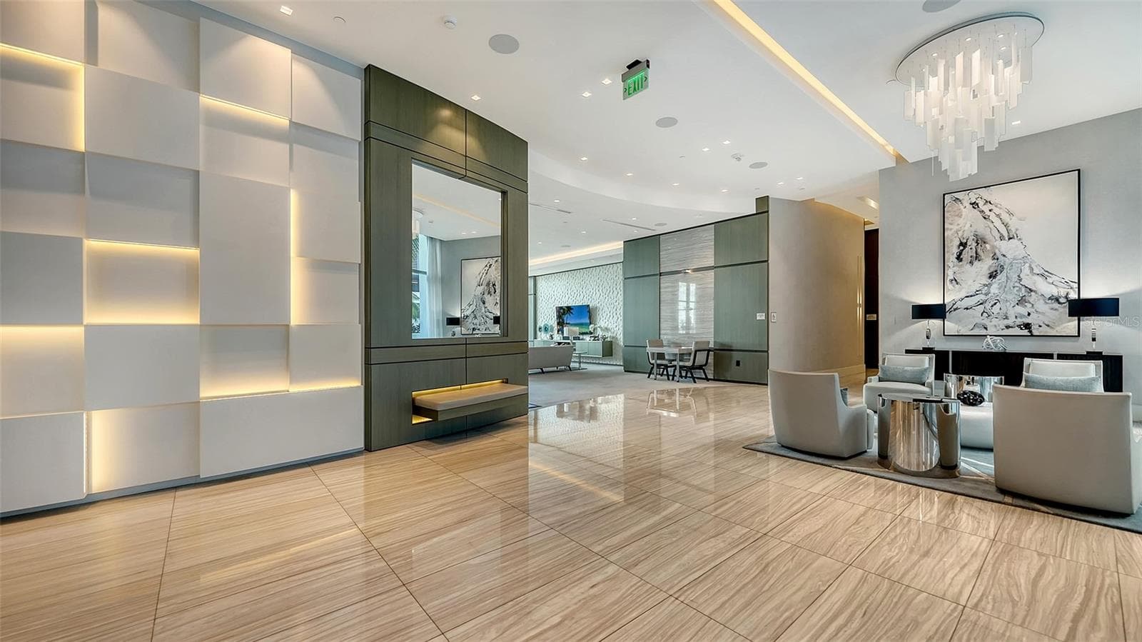 A grand, elegant entrance featuring refined seating areas, creating a warm and sophisticated welcome for residents and their guests. - 1155 N GULFSTREAM AVE #207, SARASOTA