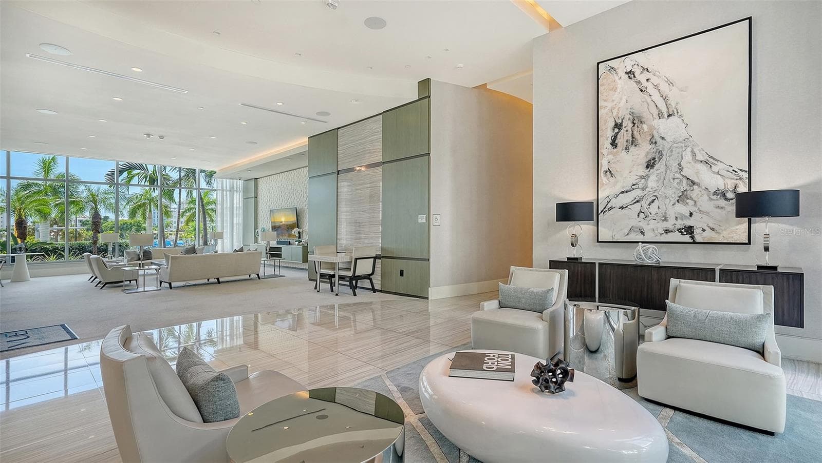 Multiple elegant lobby seating areas provide inviting spaces to welcome guests, socialize, and gather in sophisticated comfort. - 1155 N GULFSTREAM AVE #207, SARASOTA