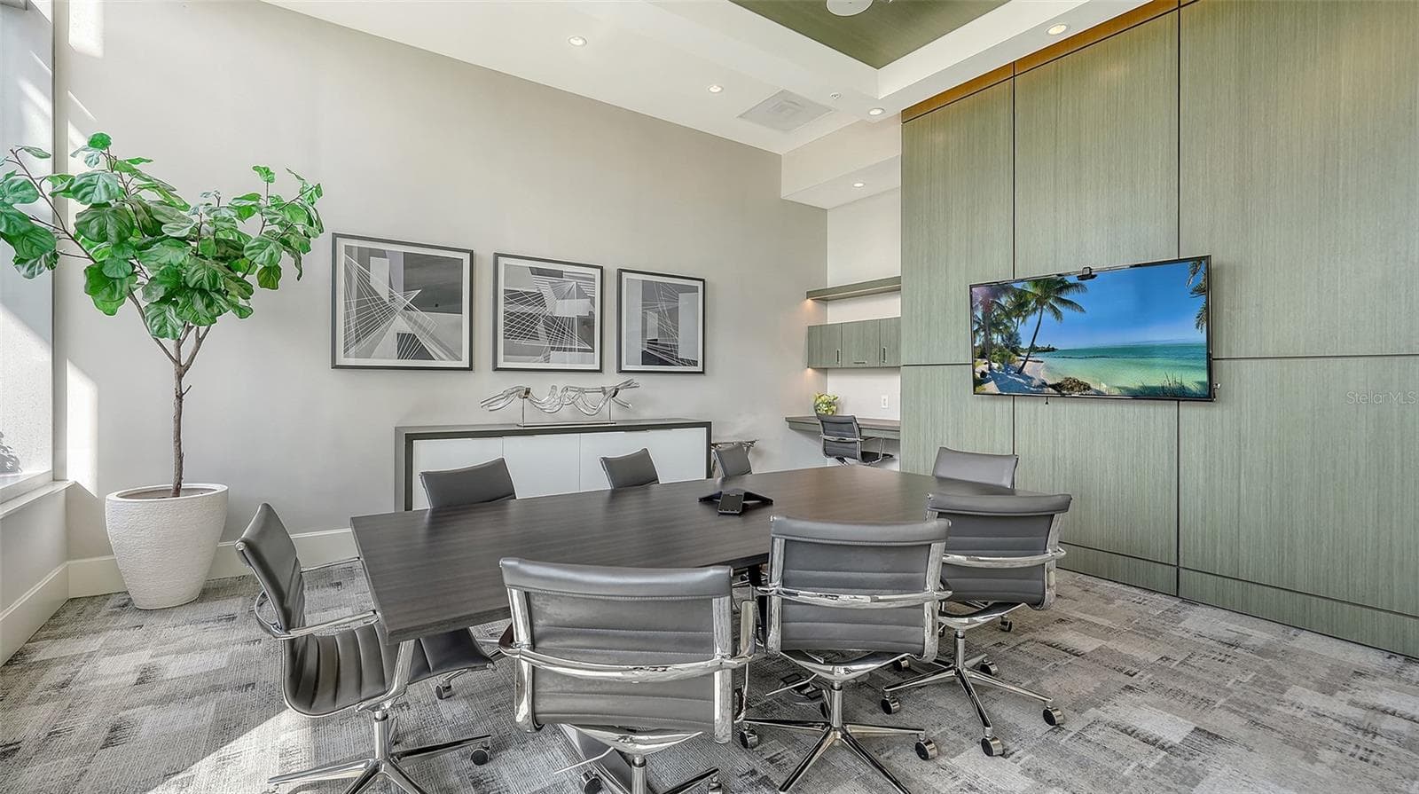 A well-appointed conference room with ample seating, ideal for important meetings, collaboration, and productive gatherings. - 1155 N GULFSTREAM AVE #207, SARASOTA