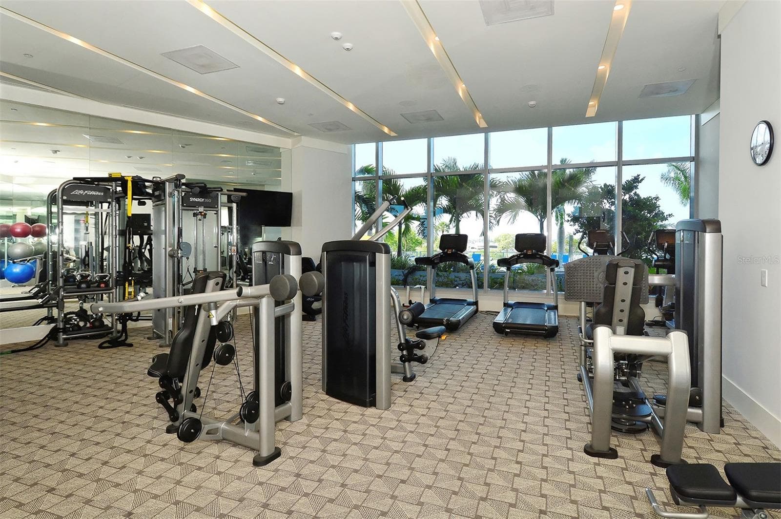 A premier fitness center designed to inspire, with state-of-the-art equipment and stunning pool and Sarasota Bay views that elevate every workout. - 1155 N GULFSTREAM AVE #207, SARASOTA