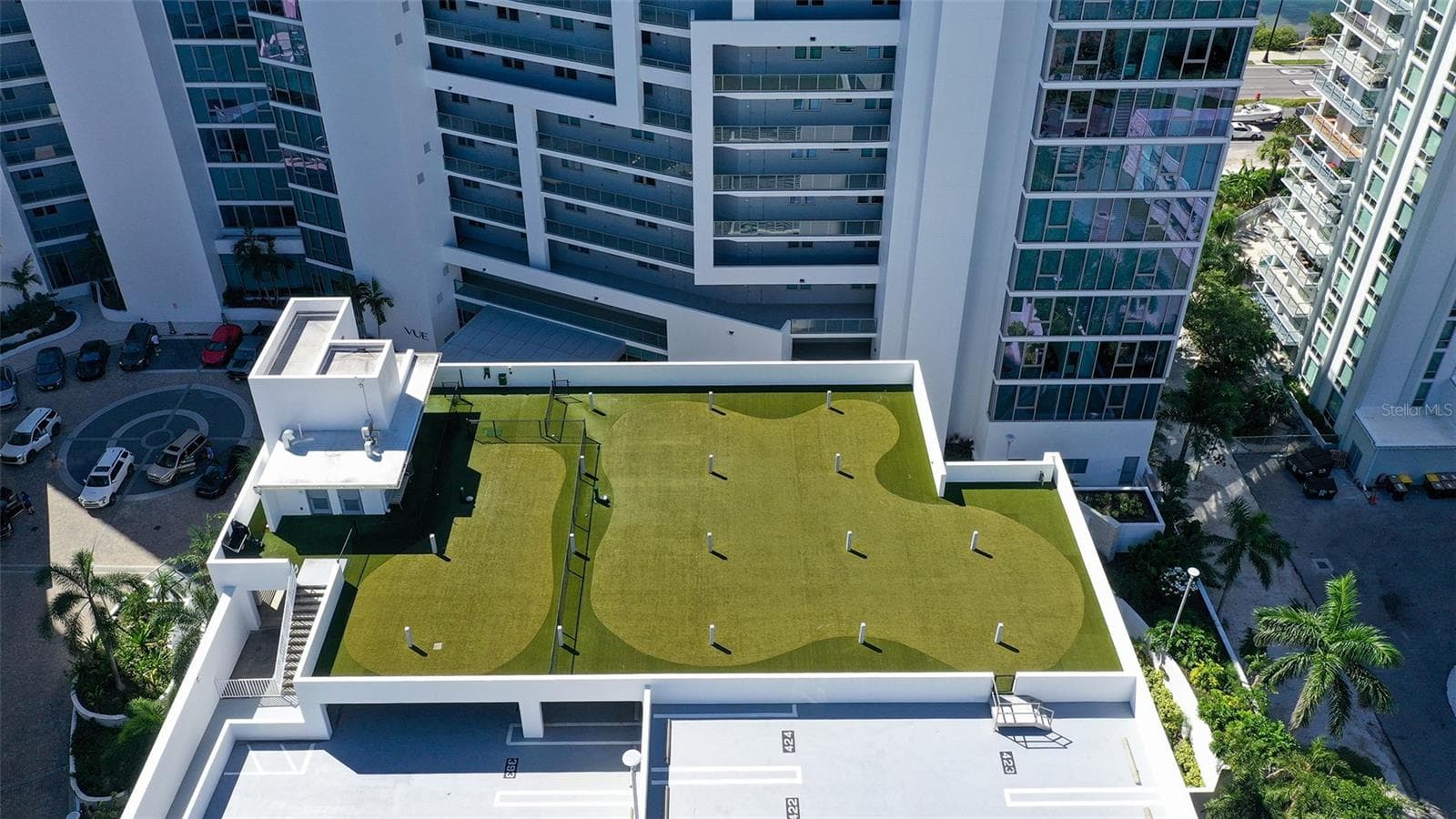 An expansive rooftop dog park offering ample space for running and playing. - 1155 N GULFSTREAM AVE #207, SARASOTA