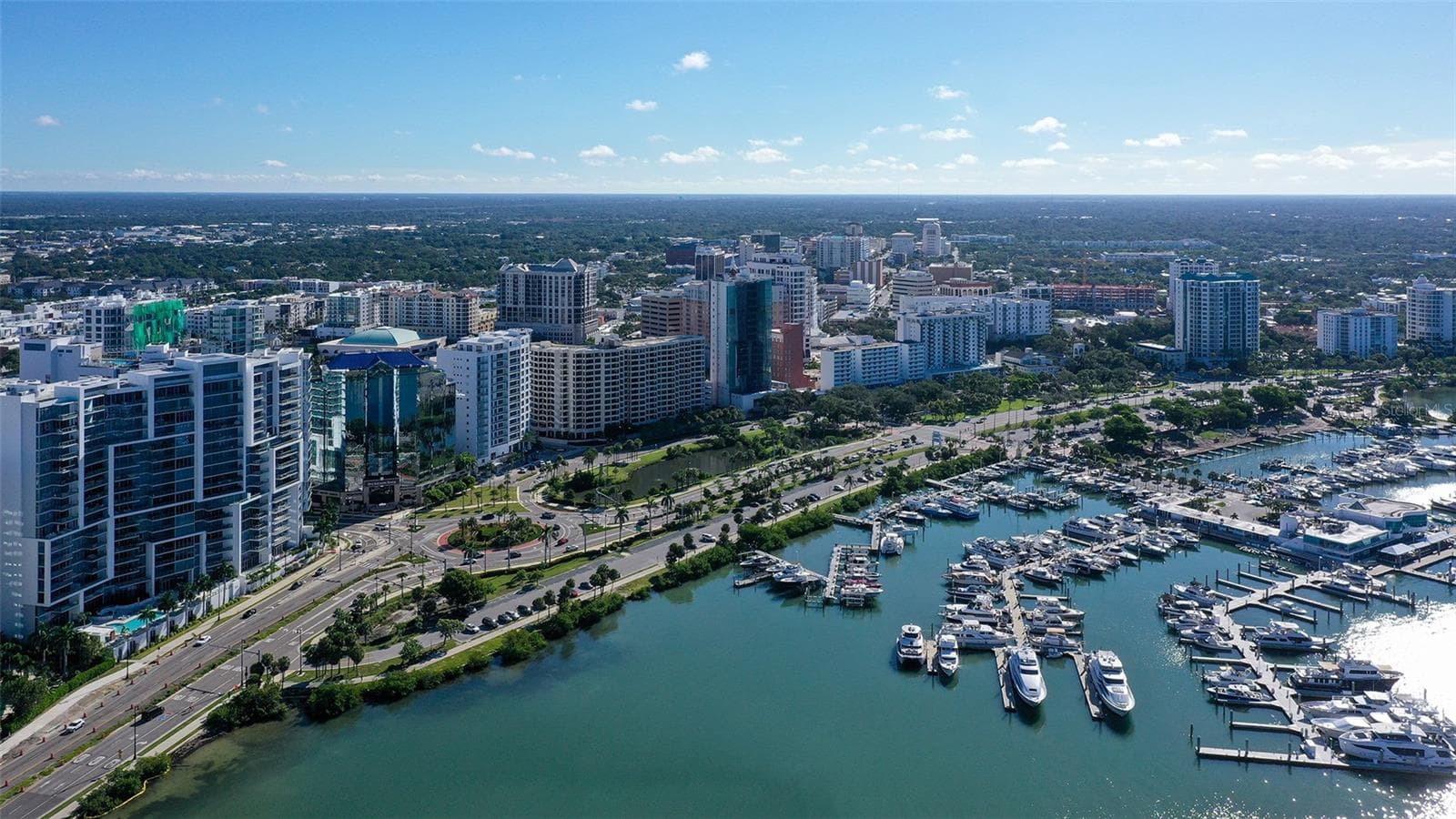 Aerial views capture The VUE’s striking waterfront presence against Sarasota’s vibrant downtown skyline. - 1155 N GULFSTREAM AVE #207, SARASOTA
