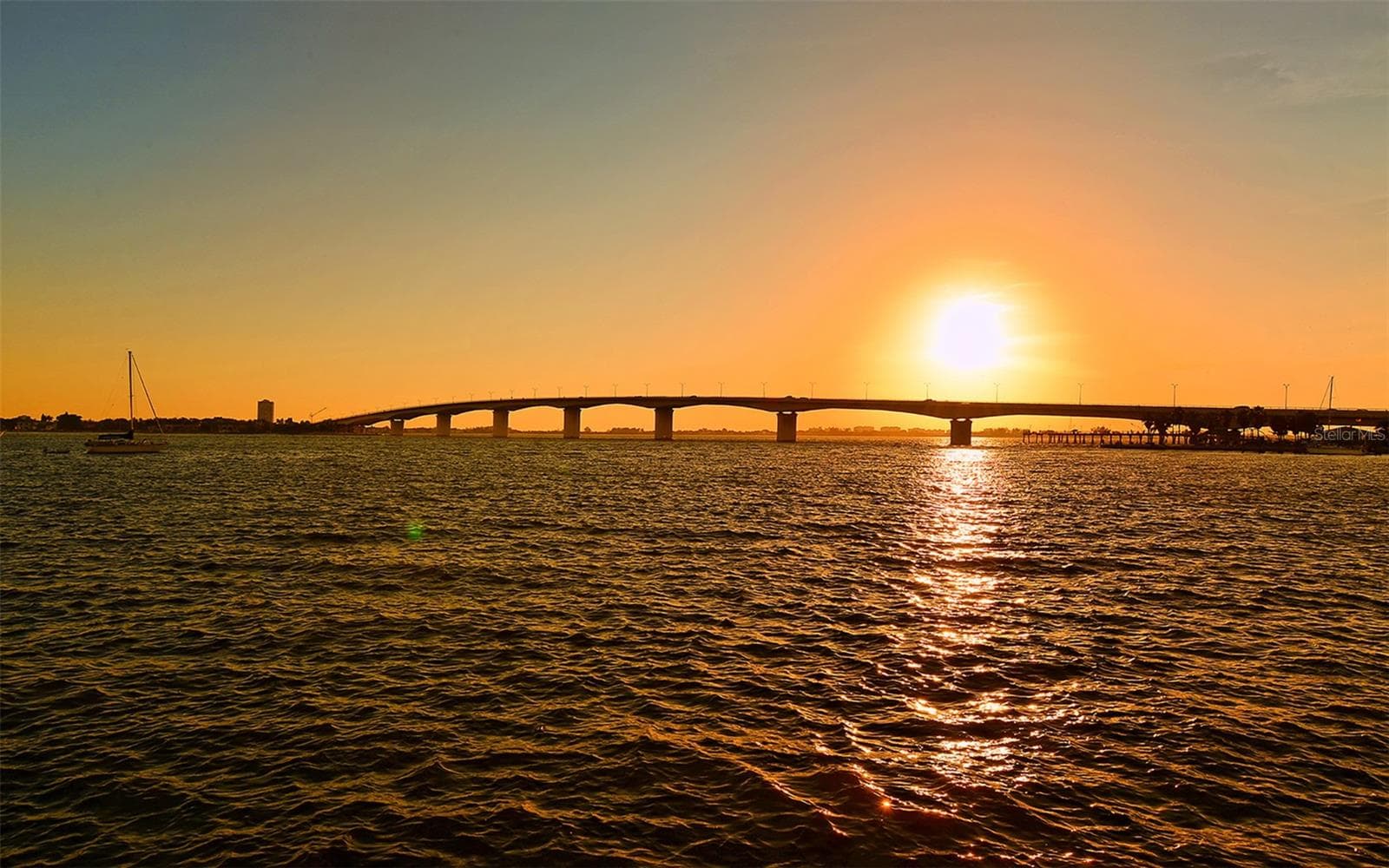 Savor breathtaking Sarasota sunsets as the sky transforms into a stunning canvas of vibrant colors over the bay. - 1155 N GULFSTREAM AVE #207, SARASOTA