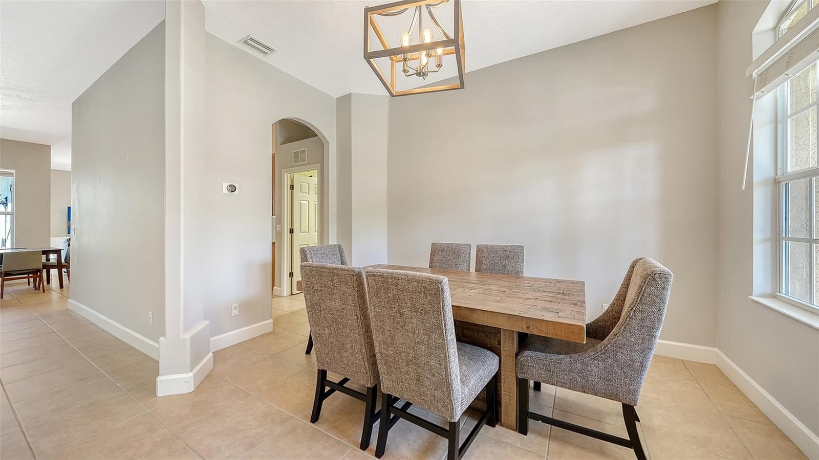 Dining Room adjacent to kitchen - 819 GOLDEN POND CT, OSPREY