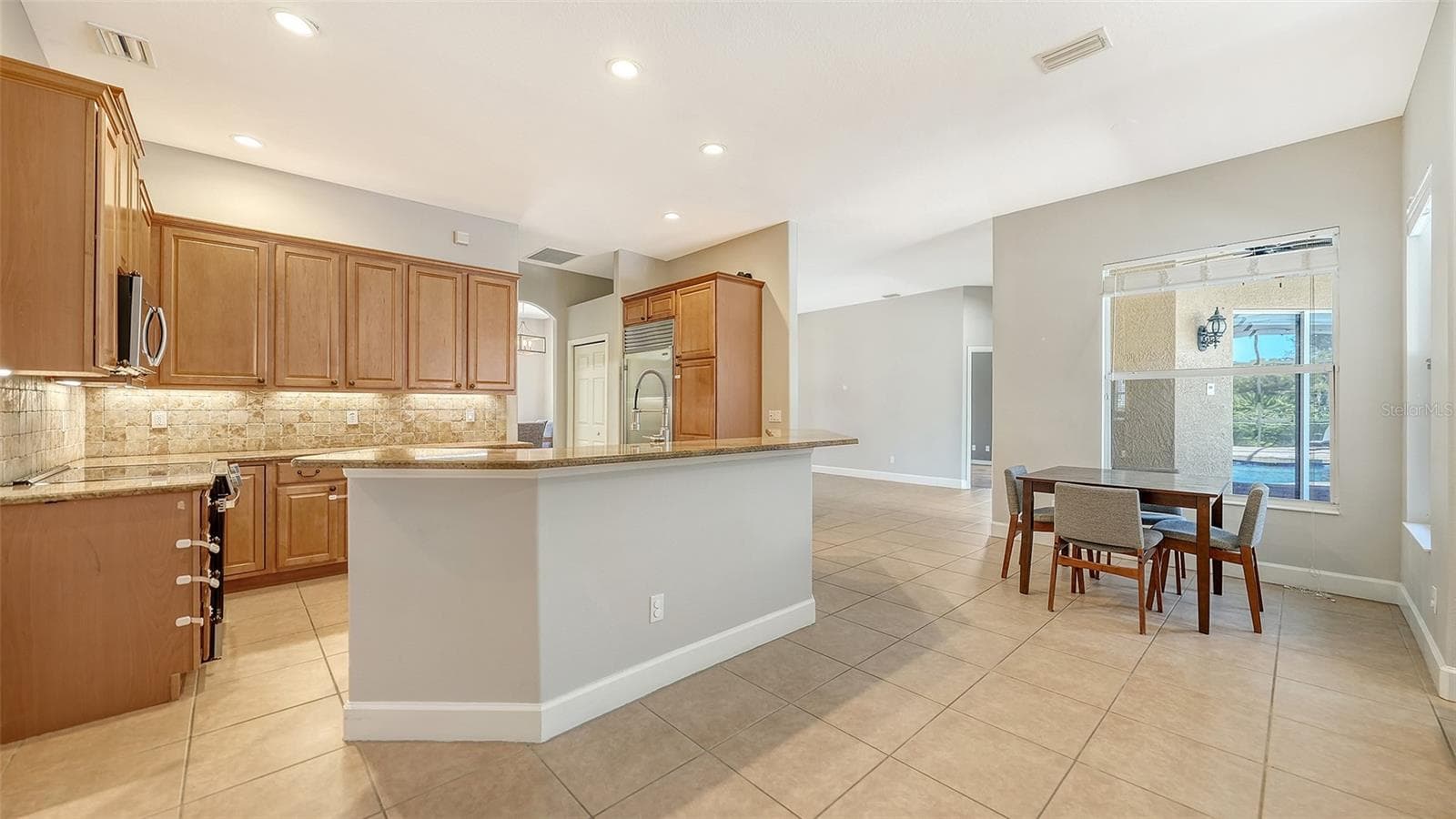 Kitchen features granite counters - 819 GOLDEN POND CT, OSPREY