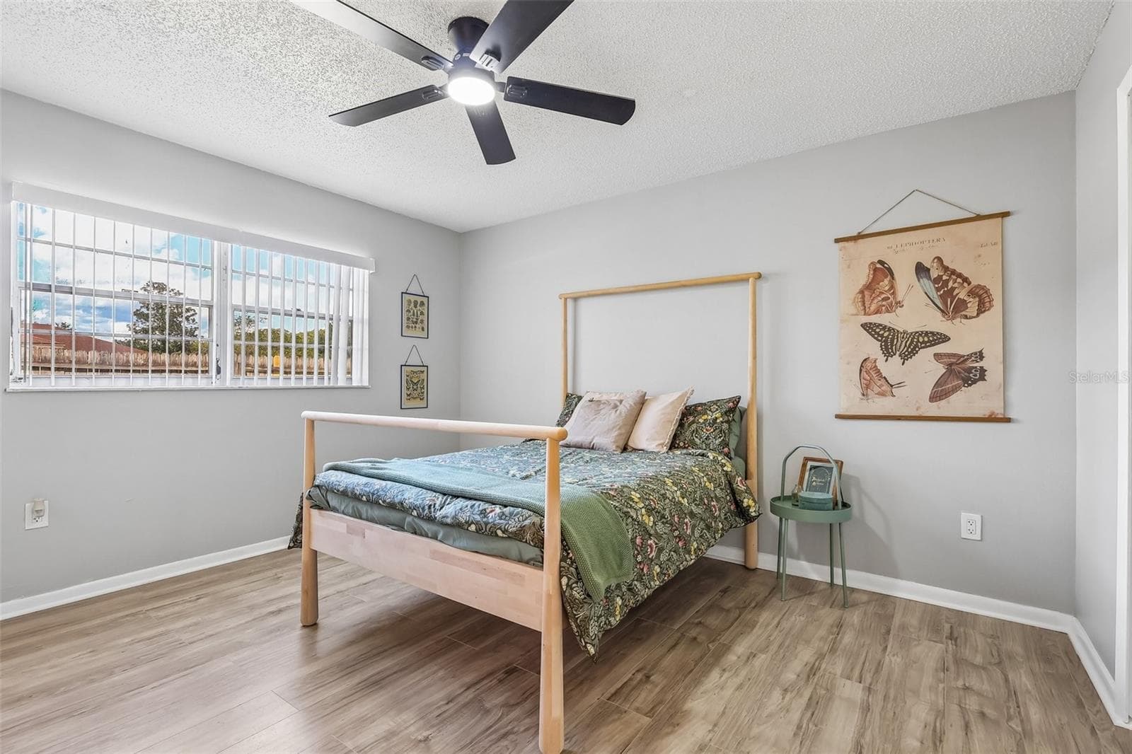 Welcome to your primary retreat! The wood-look vinyl flooring transitions nicely to the bedrooms - 1332 BOREAS DR, ORLANDO