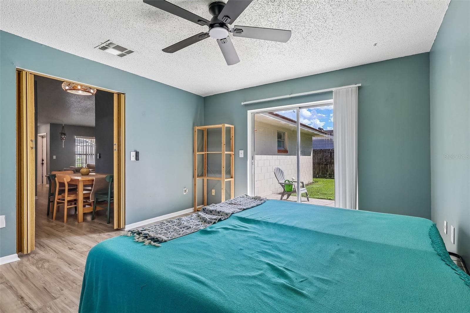 There is a partition to close off this room for privacy as well as a sliding glass door to access the backyard - 1332 BOREAS DR, ORLANDO