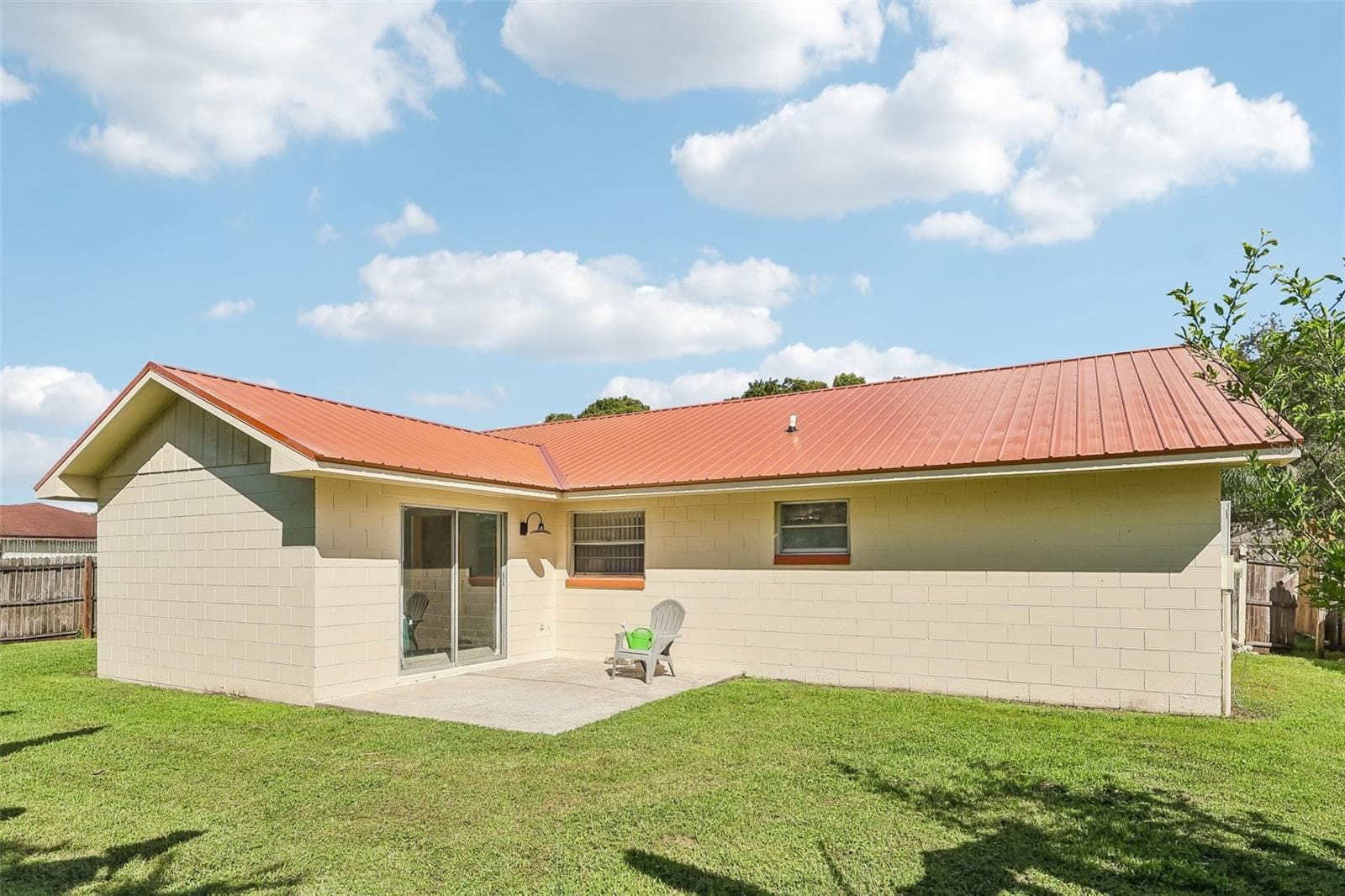 Check out your BRAND NEW METAL ROOF and a porch ready for grilling and lounging - 1332 BOREAS DR, ORLANDO