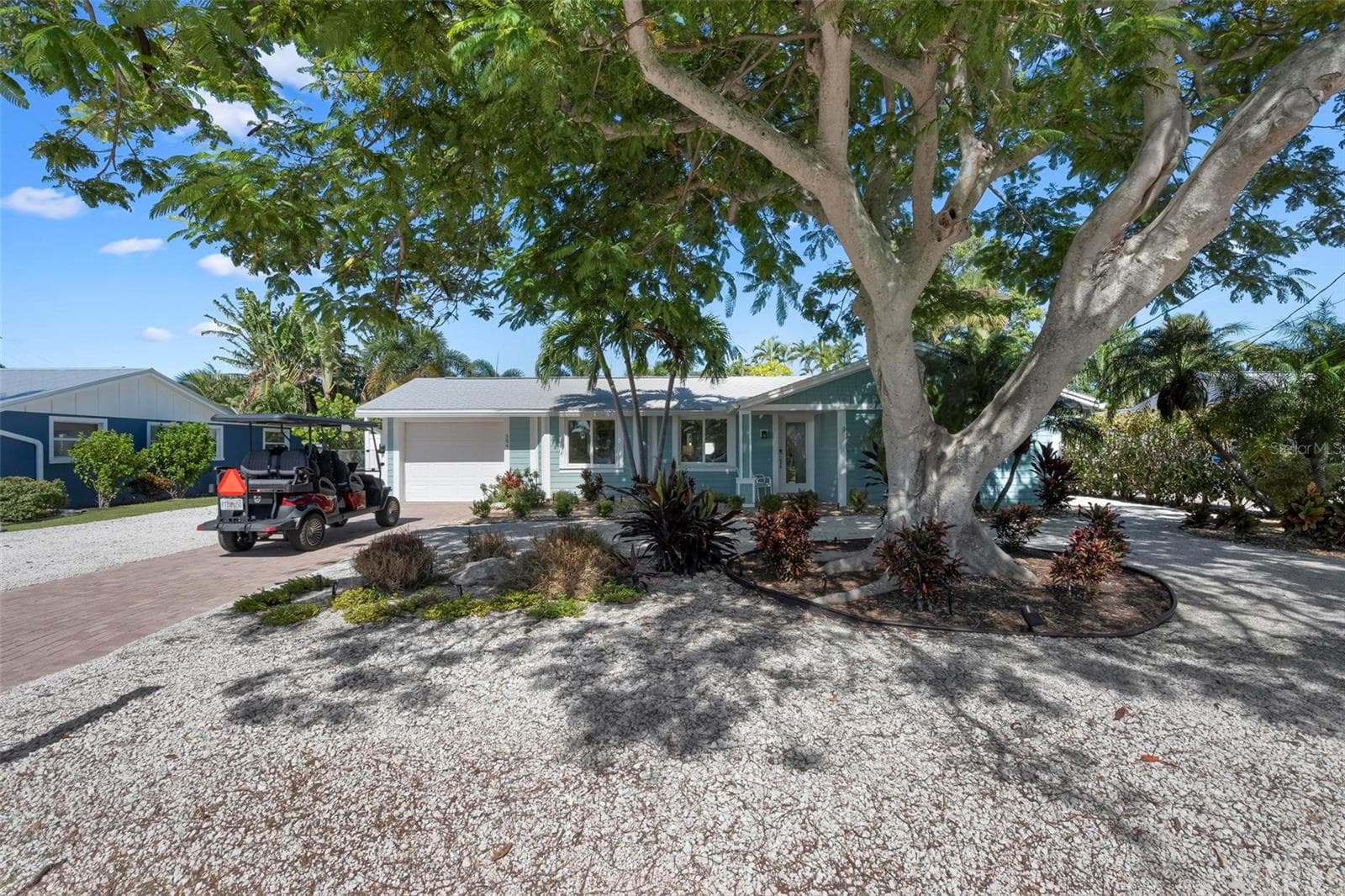 Front of home with beautiful poinciana tree - 504 69TH ST, HOLMES BEACH