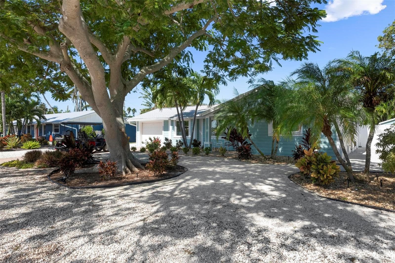 Front of home with beautiful poinciana tree - 504 69TH ST, HOLMES BEACH