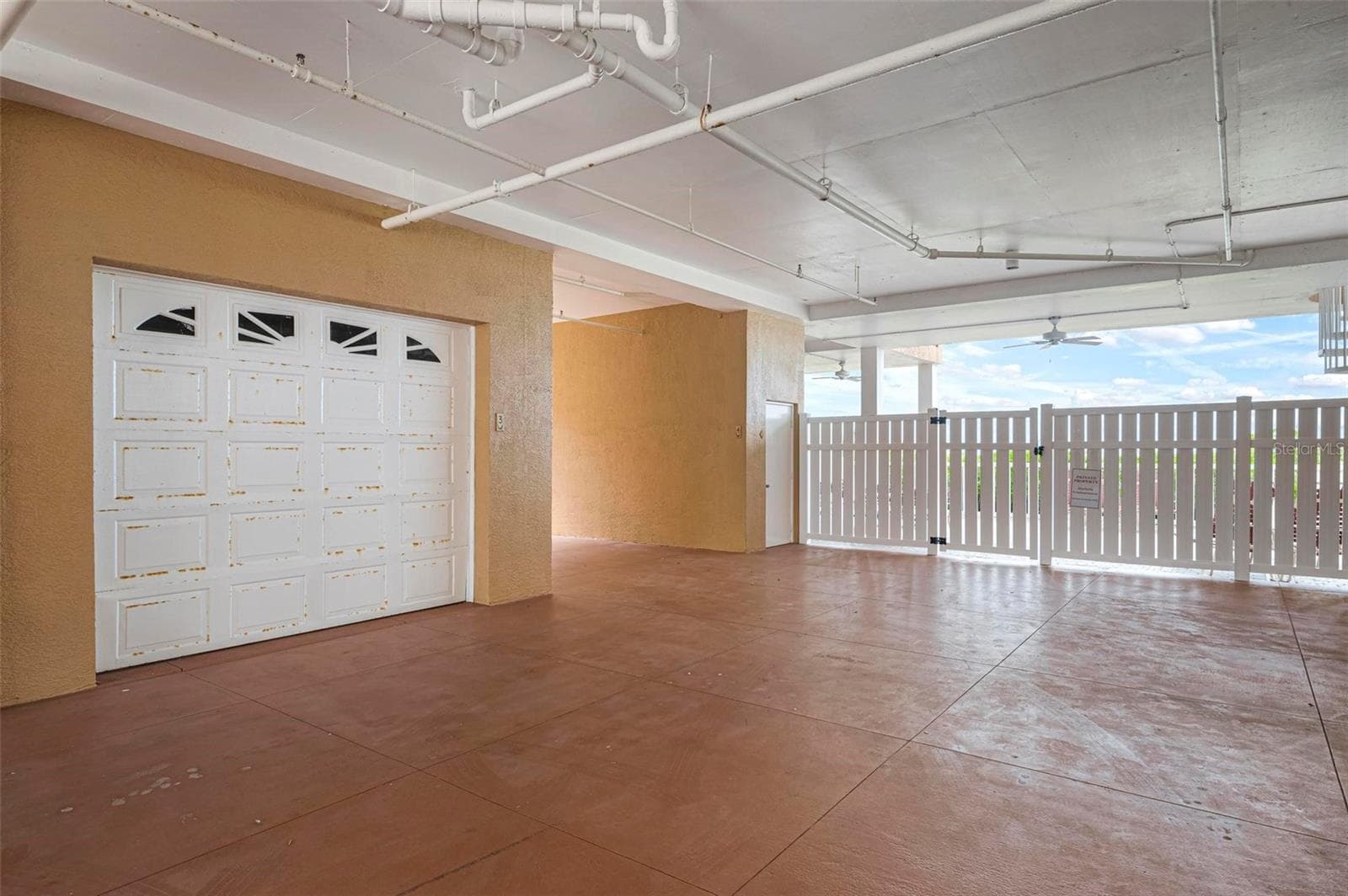 1 car garage under the building - 1900 GULF DR N #1, BRADENTON BEACH
