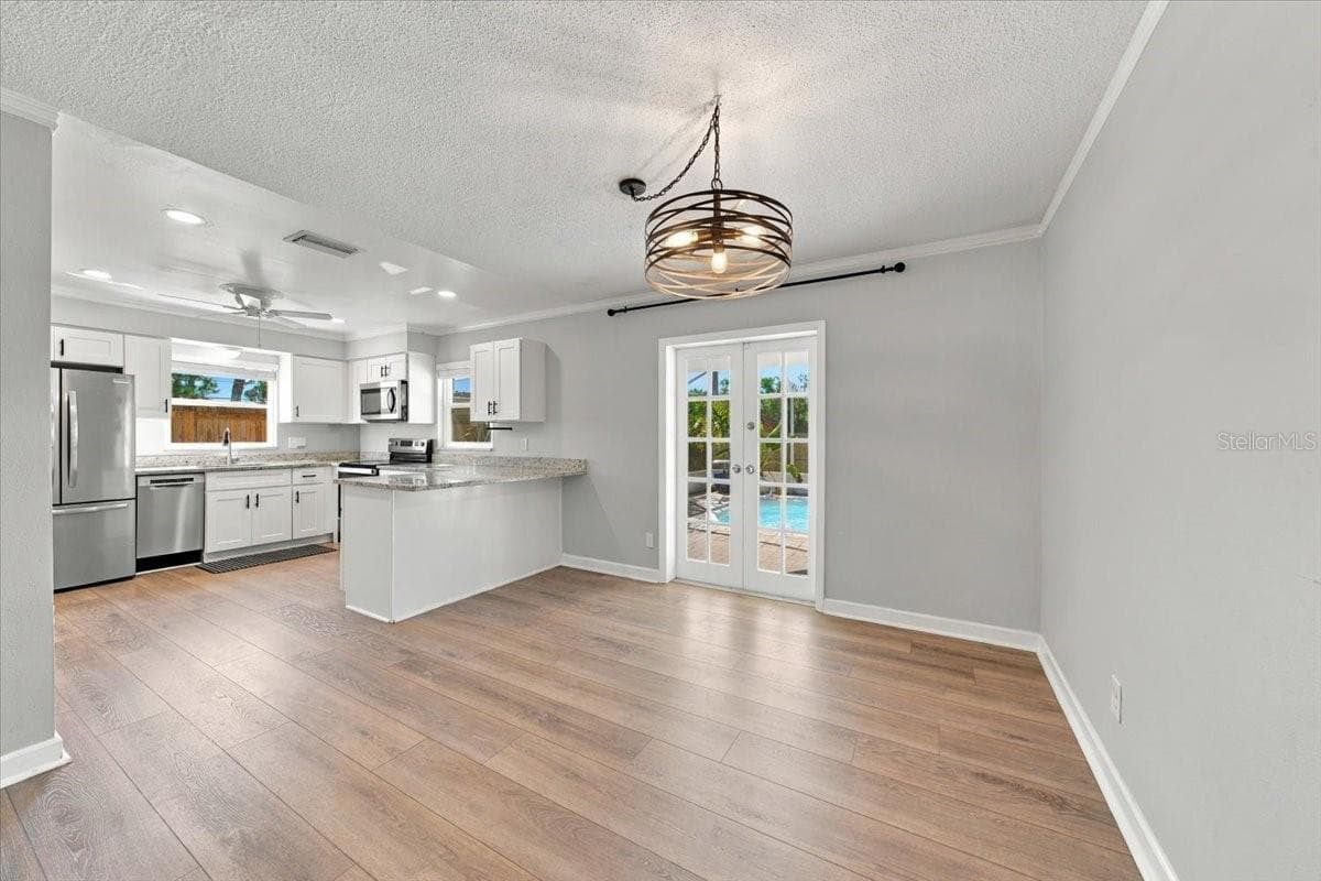 Dining and kitchen area - 5220 90TH TER N, PINELLAS PARK