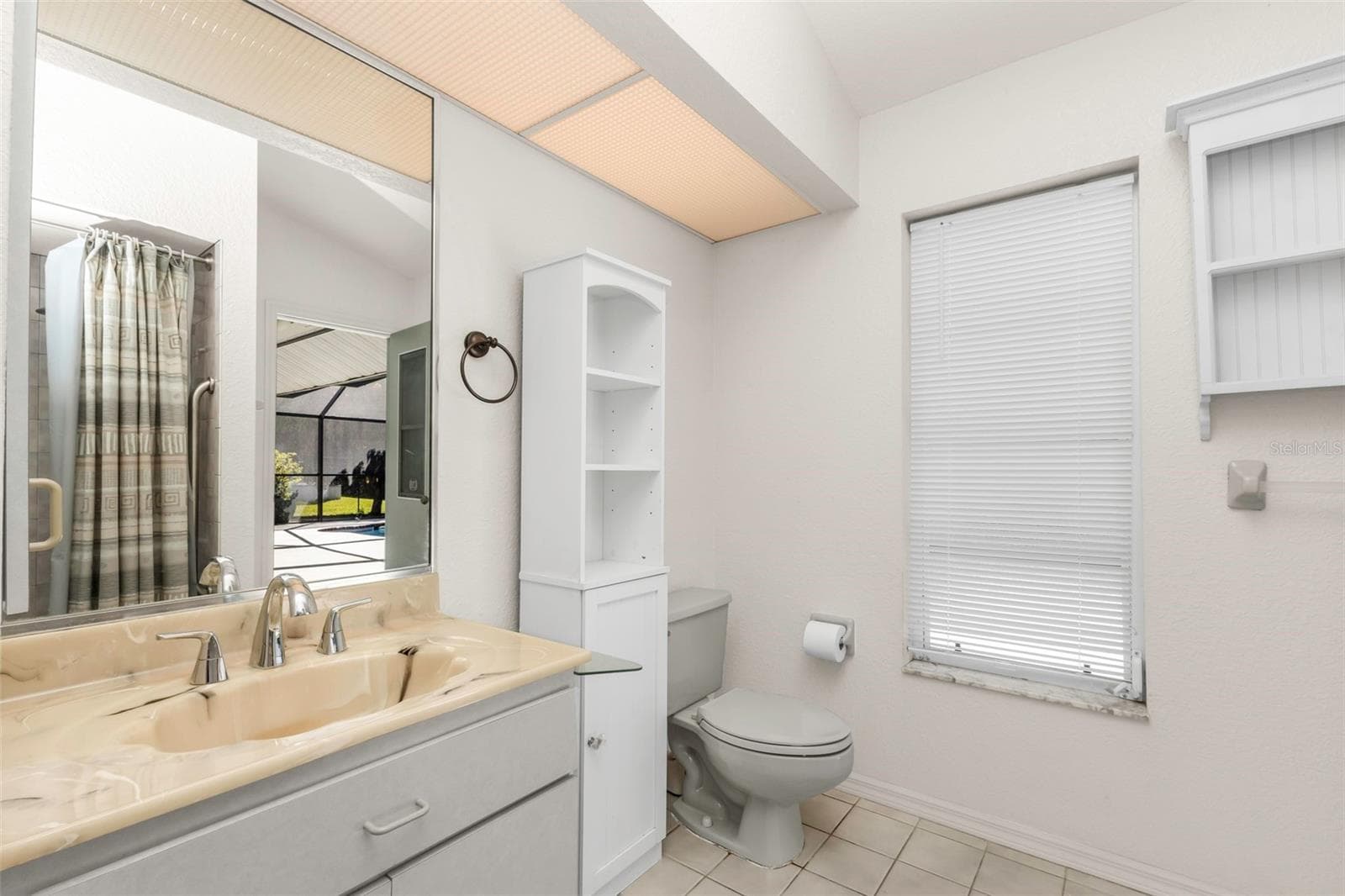Guest bath w/access to the pool - 5184 ELLSWORTH TER, PORT CHARLOTTE