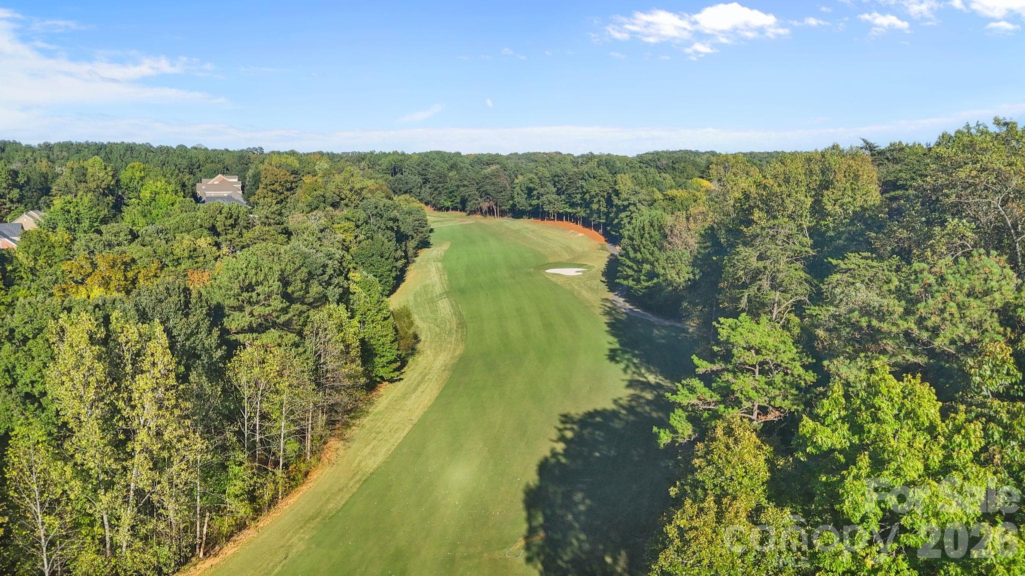 The home is located on the 3rd fairway of The Palisades country club golf course - 13700 Glen Abbey Drive, Charlotte