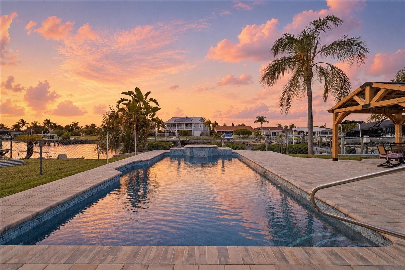 Virtually enhanced- sunset pool views facing west. - 5001 MARLIN DR, NEW PORT RICHEY