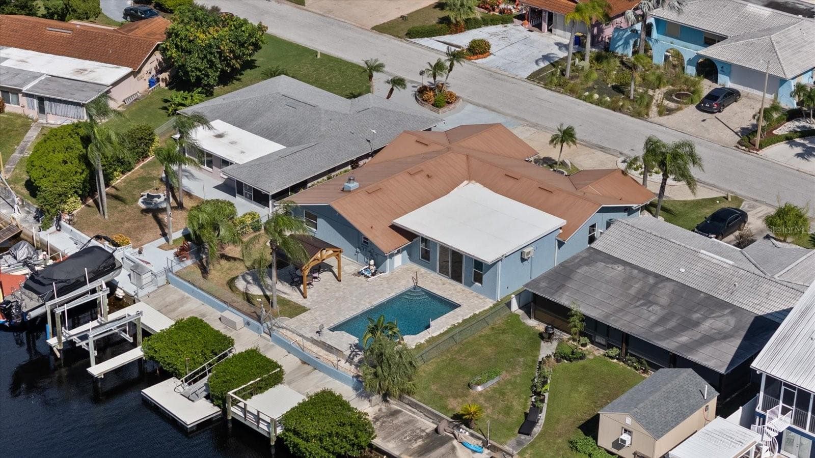 Aerial of home showing waterfall pool, gazebo, boat lift, floating dock and stationary dock - 5001 MARLIN DR, NEW PORT RICHEY