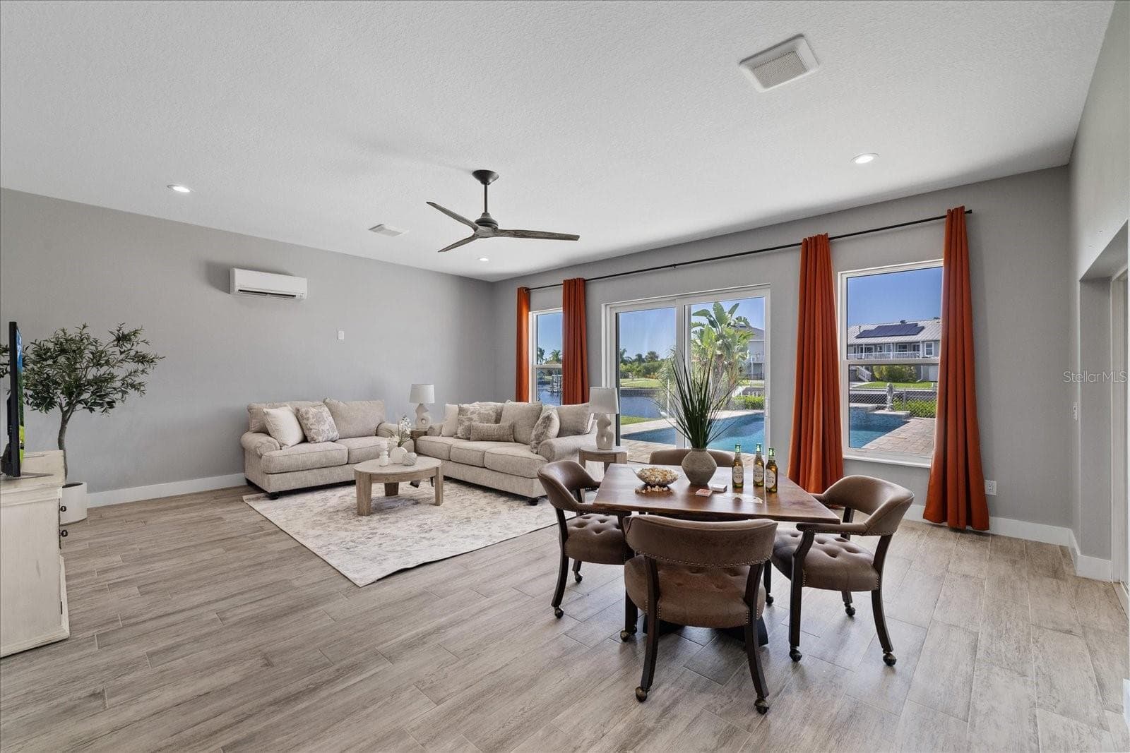 Large family room with water and pool views - 5001 MARLIN DR, NEW PORT RICHEY