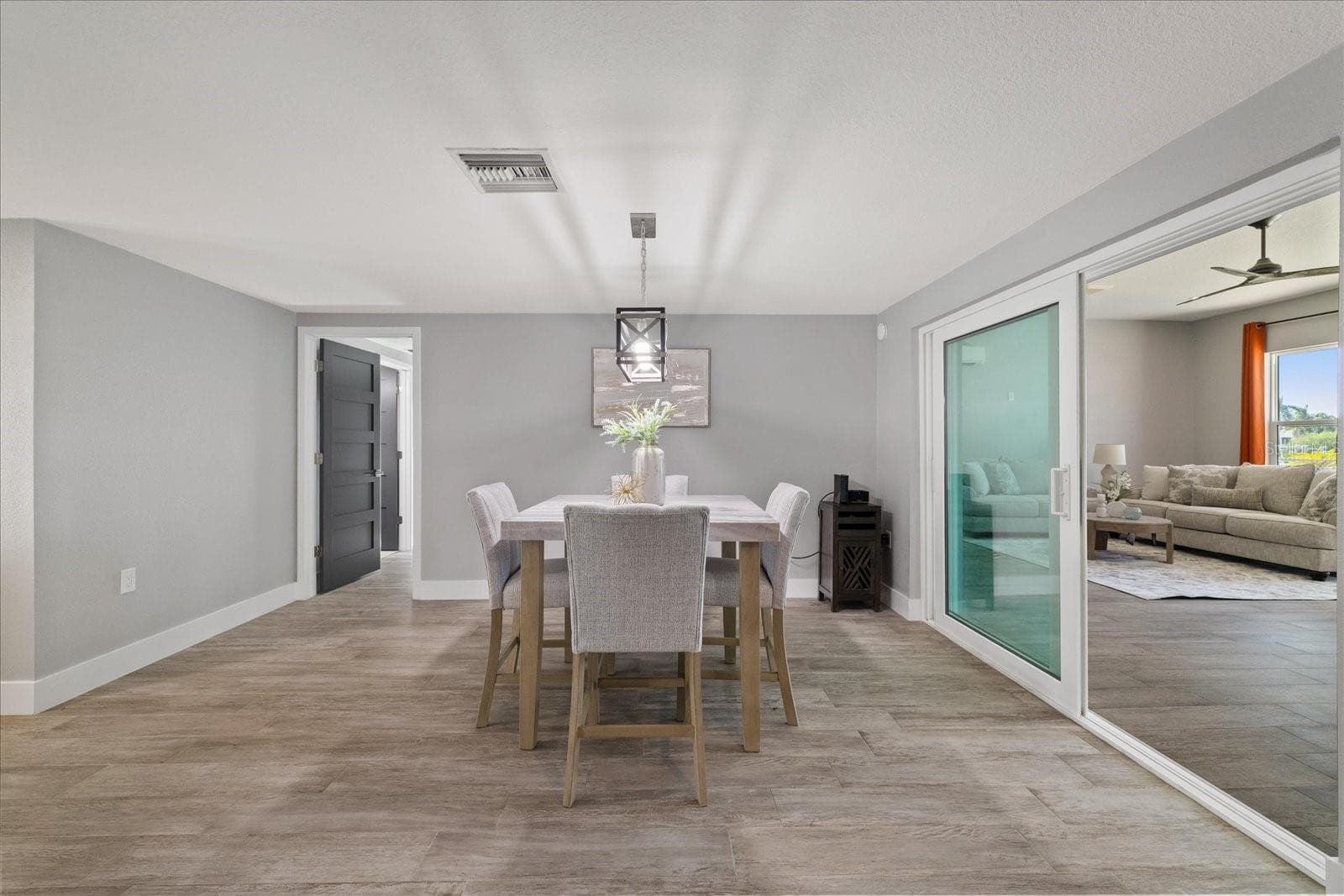 Dining area and sliders to family room - 5001 MARLIN DR, NEW PORT RICHEY