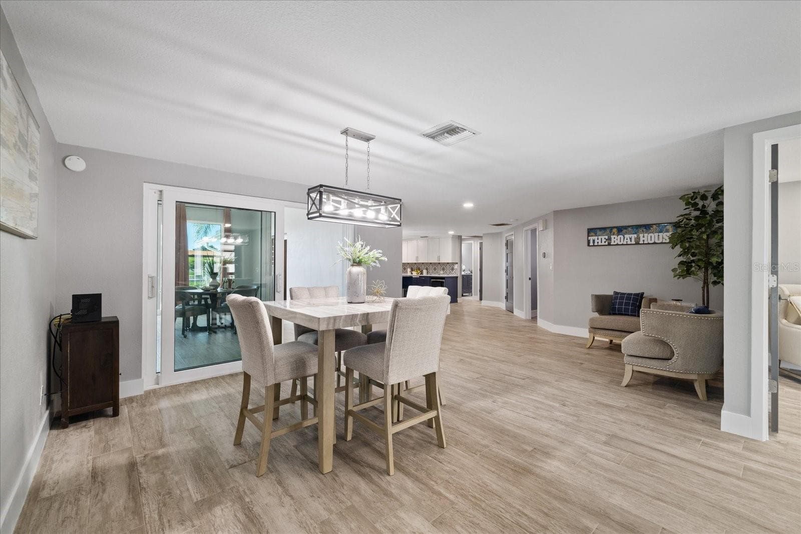 View looking from primary bedroom doorway towards dining/office/kitchen - 5001 MARLIN DR, NEW PORT RICHEY