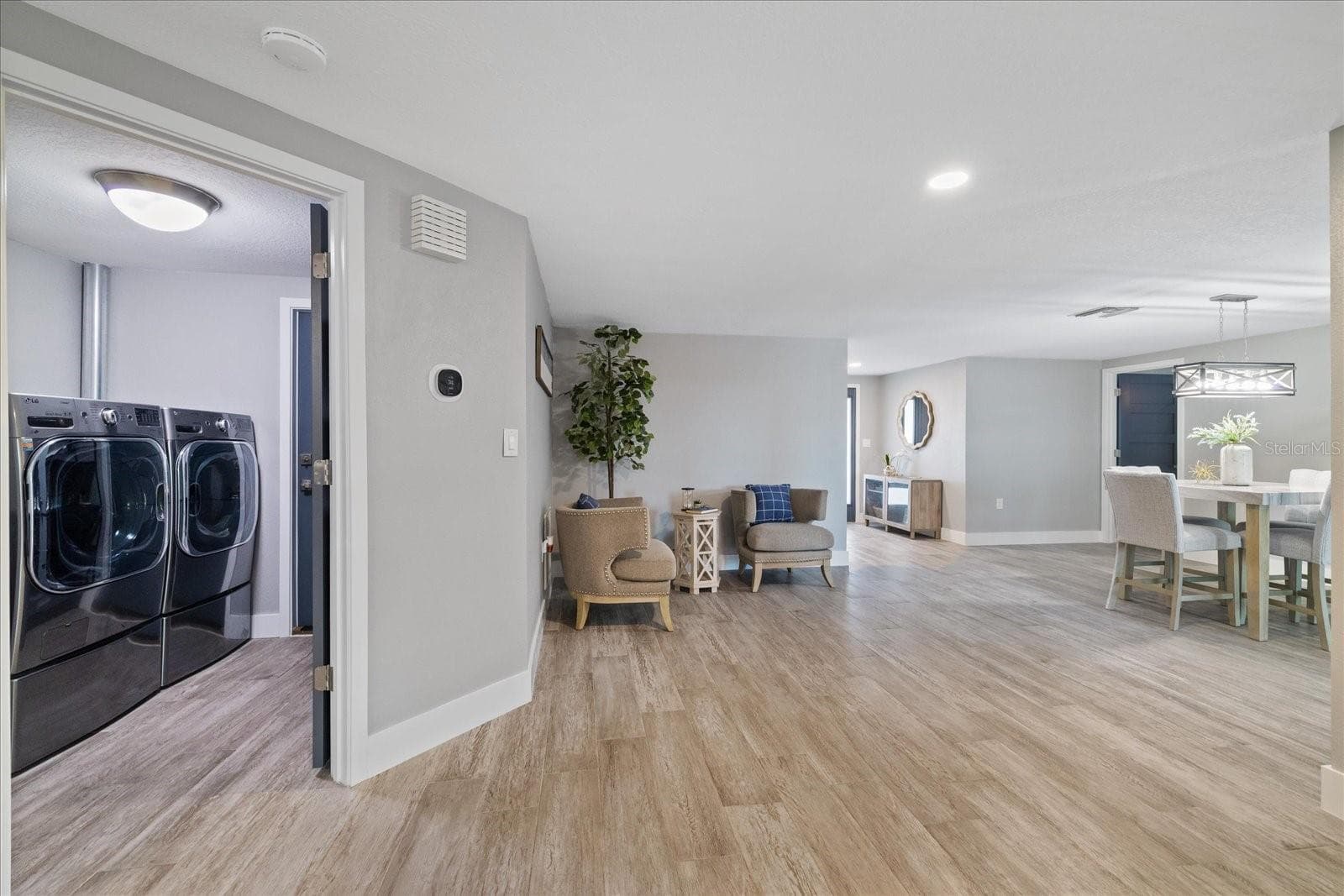 Laundry room centrally located and climate controlled with garage access door. - 5001 MARLIN DR, NEW PORT RICHEY