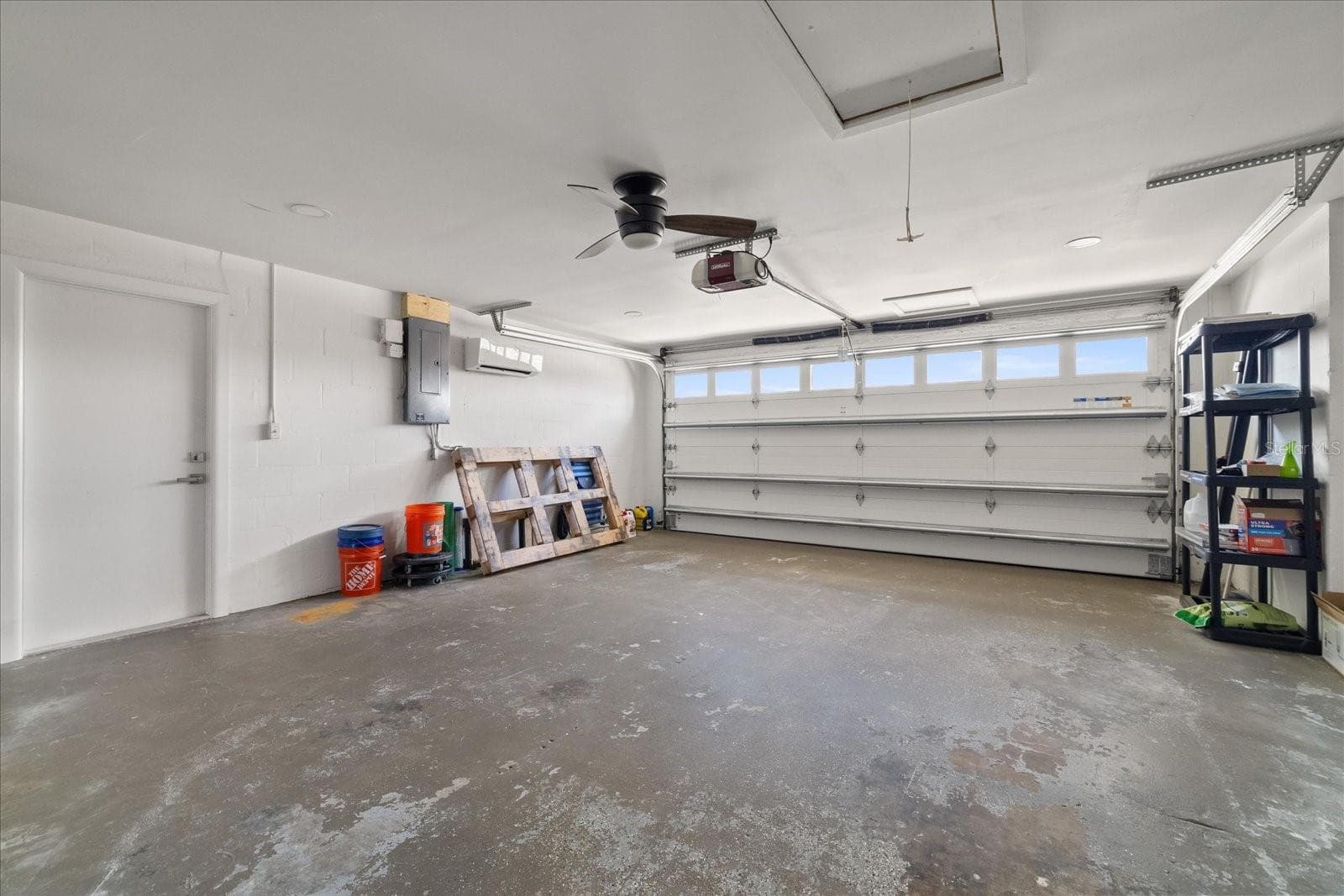 Large garage with hurricane rated door and mini split. - 5001 MARLIN DR, NEW PORT RICHEY