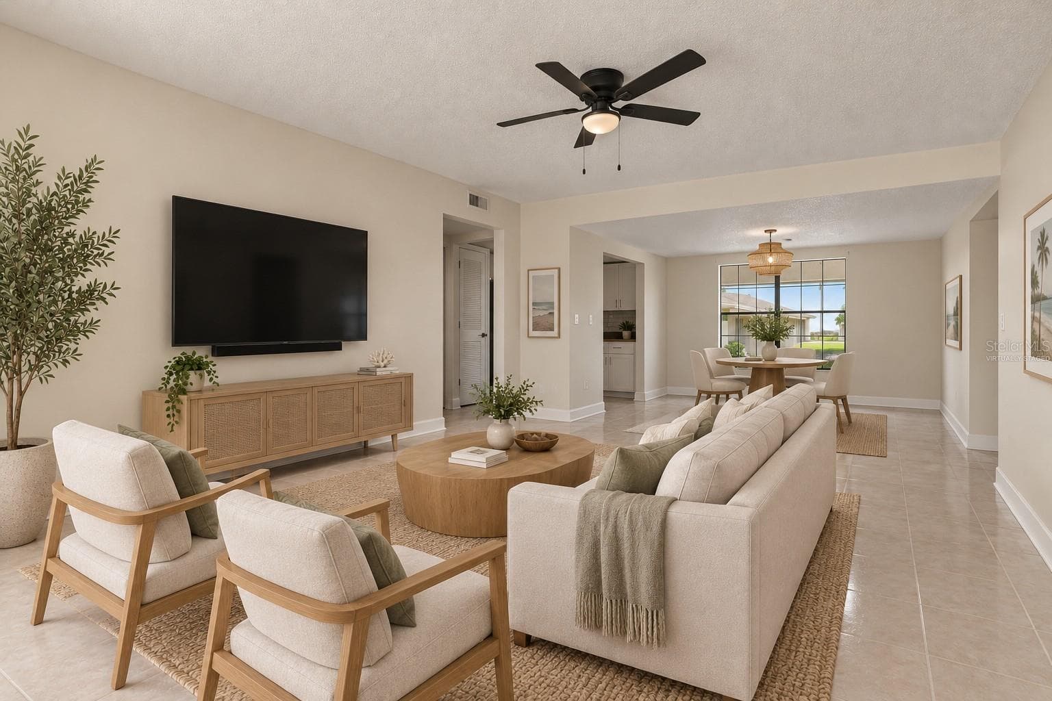 Virtually Staged - The Living Room is light, bright, and open with a lovely natural flow. - 2460 HERON TER #102E, CLEARWATER