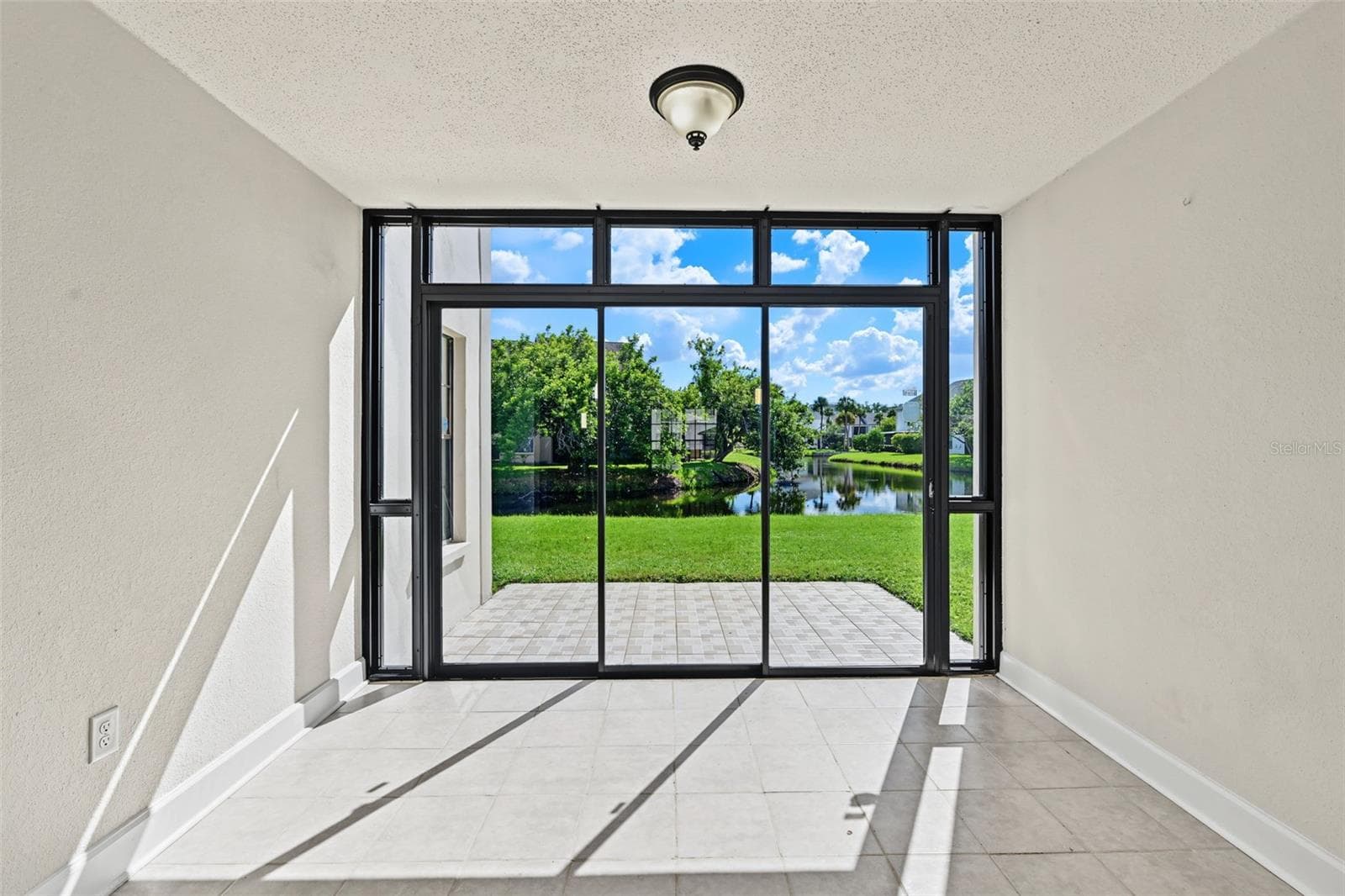This area is rare and adds extra space that could be used as a sunroom, office, den, or studio. It sits just off the Living Room and looks over the water. - 2460 HERON TER #102E, CLEARWATER