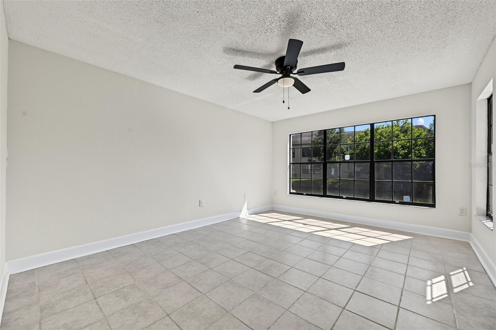 Primary Bedroom is very spacious with a large walk in closet and updated en suite bathroom - 2460 HERON TER #102E, CLEARWATER