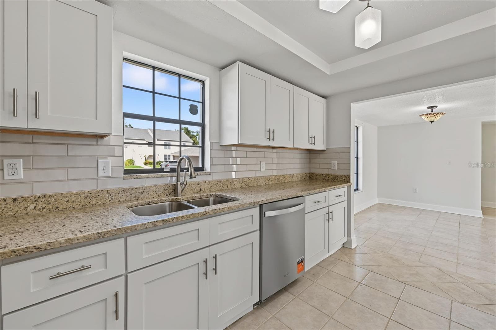 The Kitchen leads to the Dining Area - 2460 HERON TER #102E, CLEARWATER