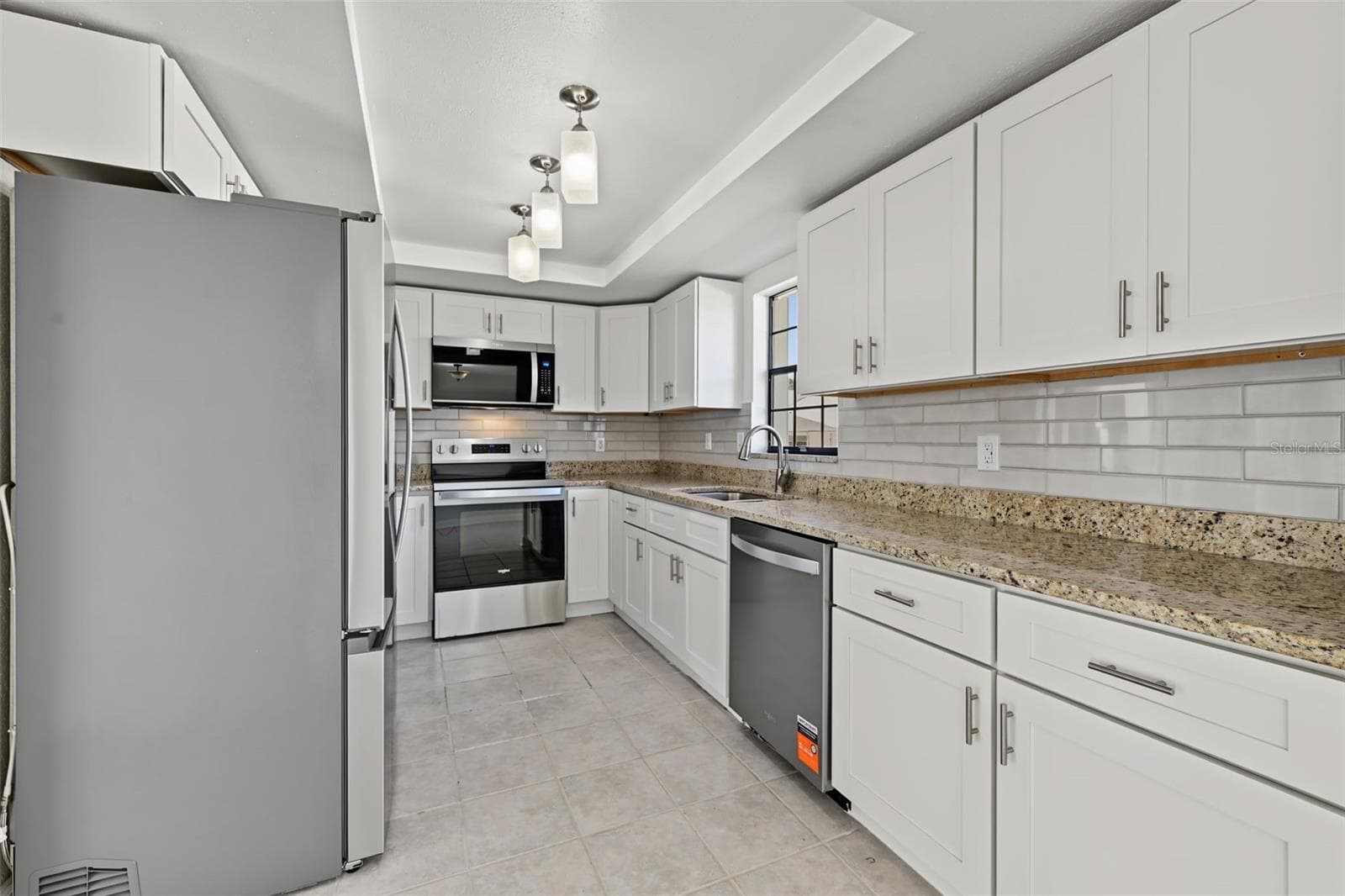 The Kitchen has ample storage and counter space. - 2460 HERON TER #102E, CLEARWATER