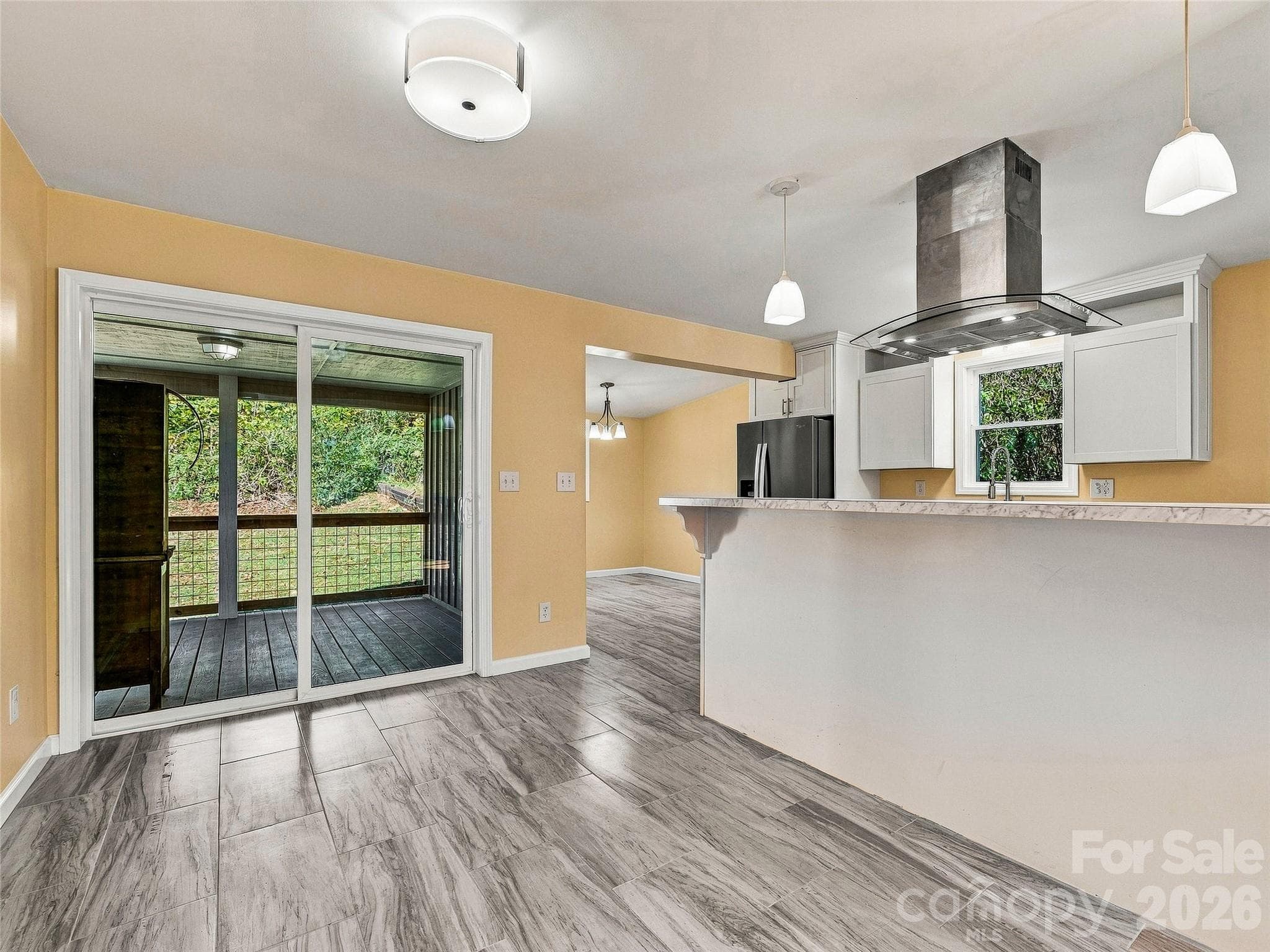 sliding glass doors lead to covered rear porch - 33 Phipps Street, Weaverville