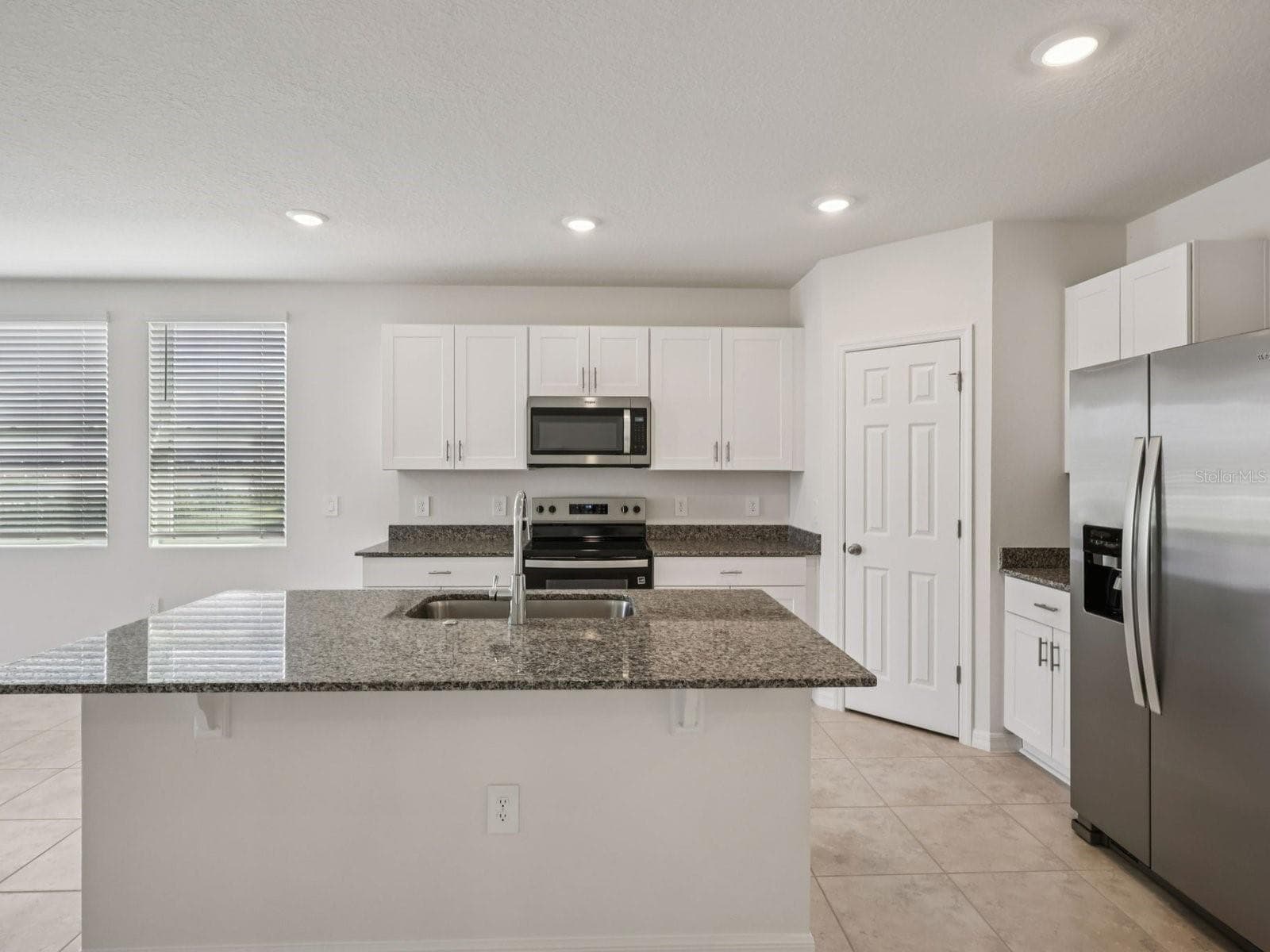 Can you make this description for VillaMar for MLS with a warm but sales appeal: This versatile floorplan offers four bedrooms, two full baths and family room, complemented by an open-concept kitchen, dining area, and great room designed for gathering and entertaining. - 3965 GIORGIO DR, WINTER HAVEN