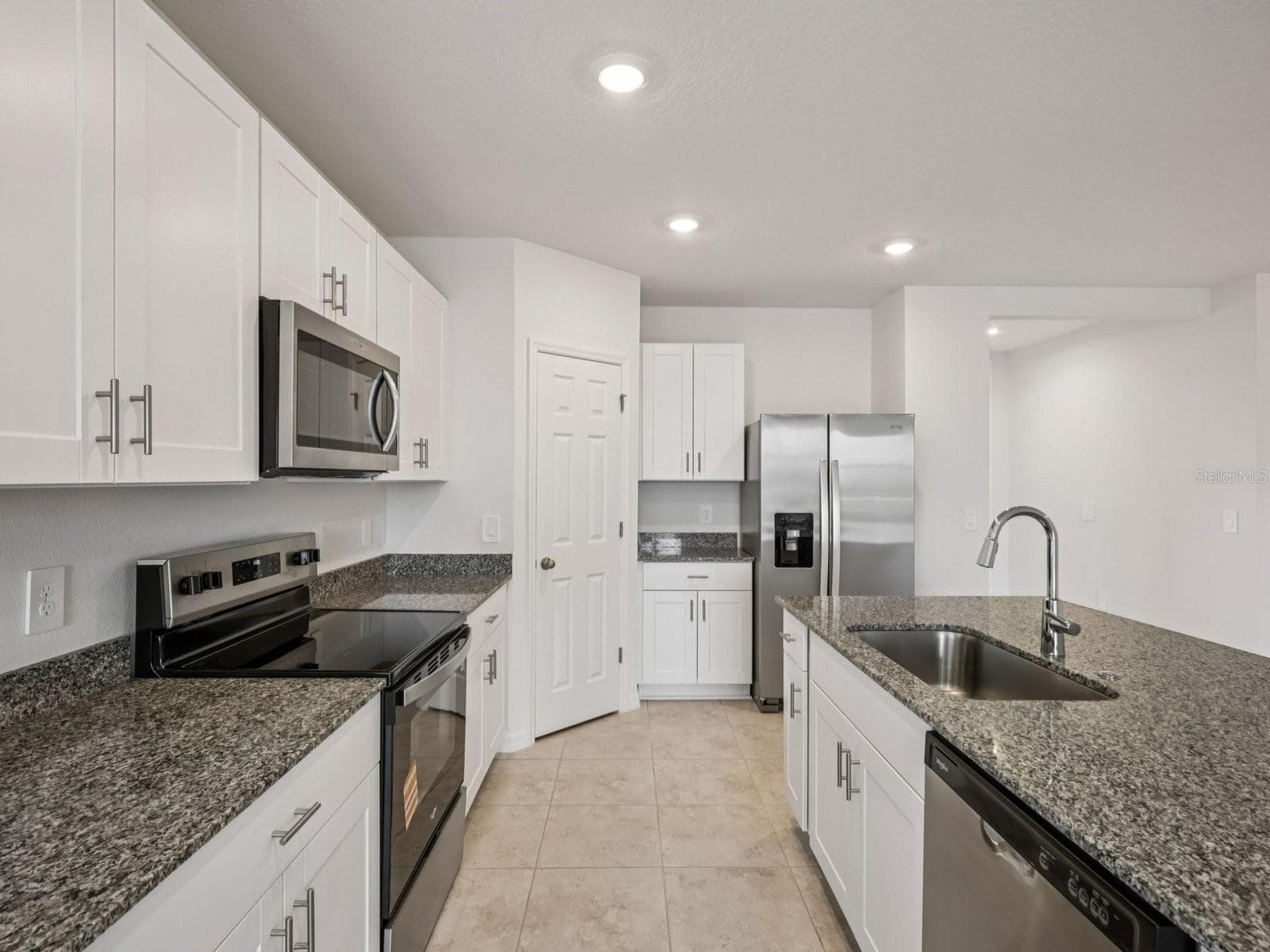 Can you make this description for VillaMar for MLS with a warm but sales appeal: This versatile floorplan offers four bedrooms, two full baths and family room, complemented by an open-concept kitchen, dining area, and great room designed for gathering and entertaining. - 3965 GIORGIO DR, WINTER HAVEN